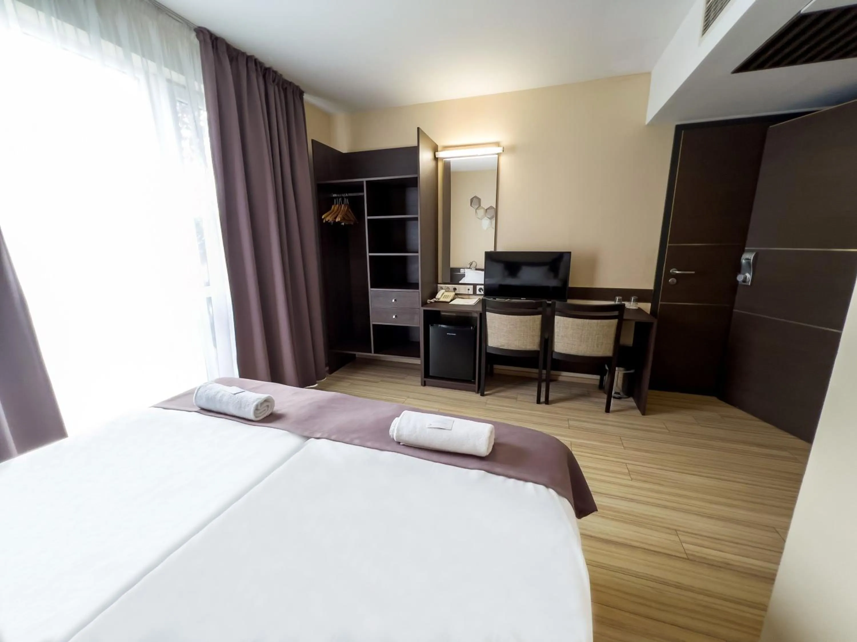 Bed in CE Plaza Hotel