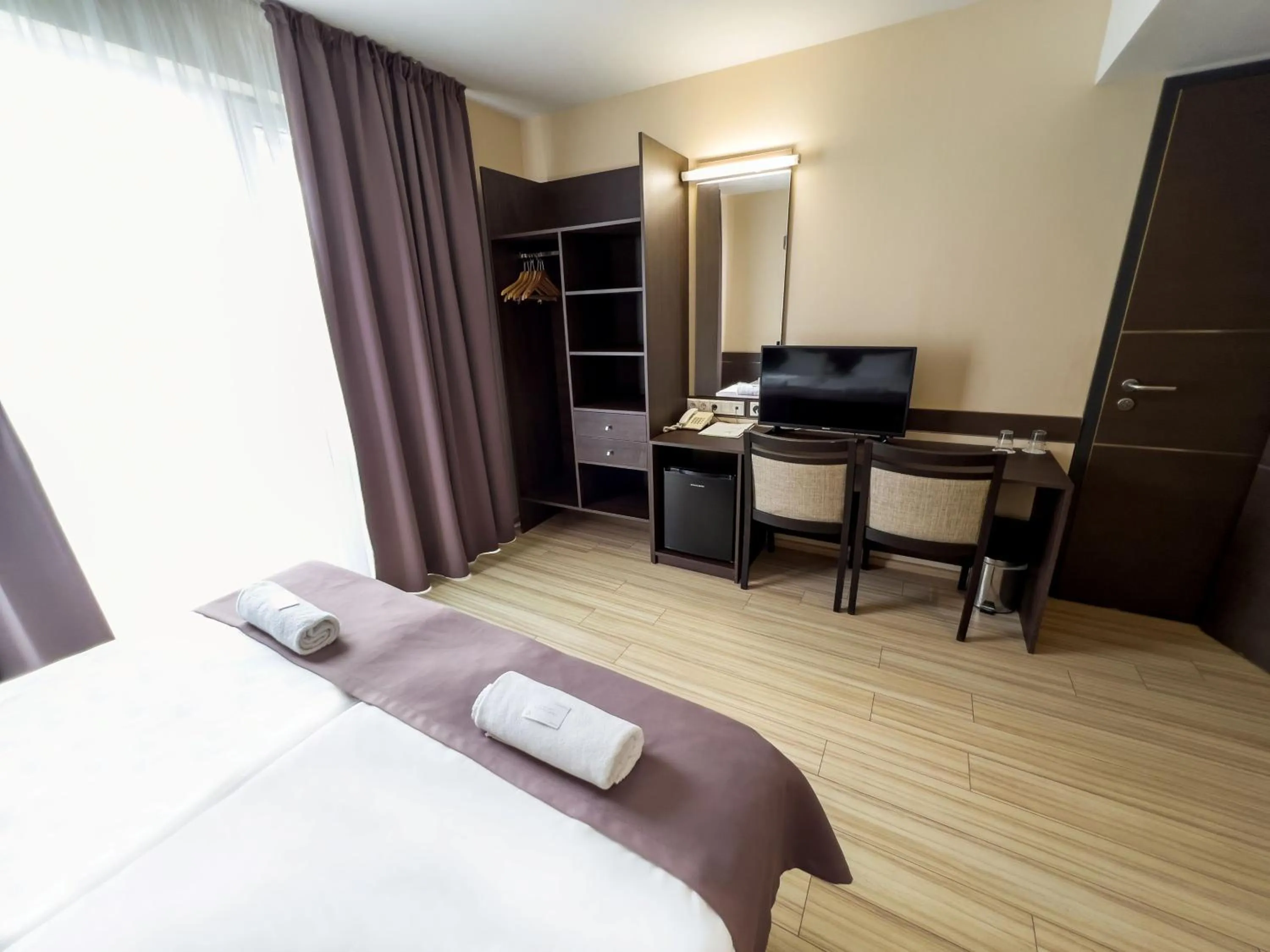 Bed in CE Plaza Hotel