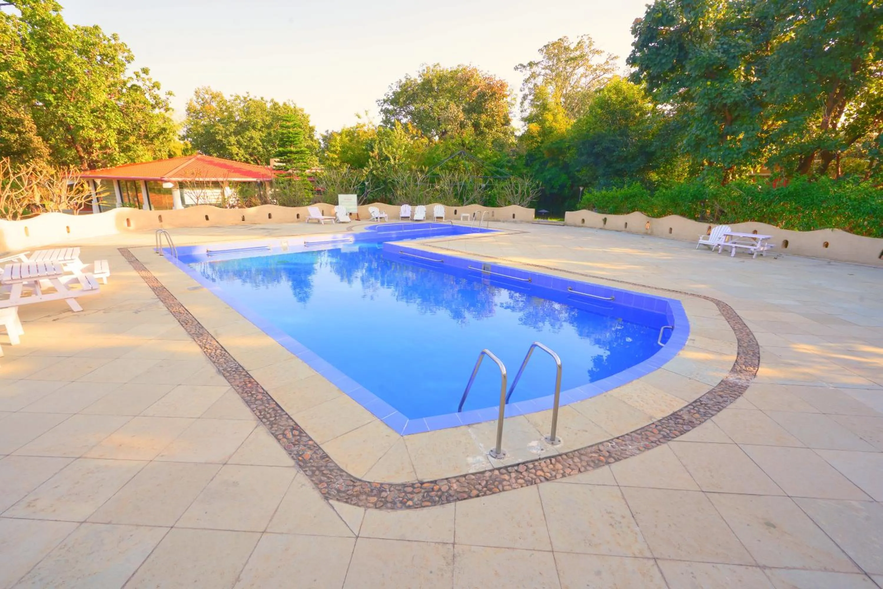 Swimming pool in Bundela Bandhavgarh by Octave