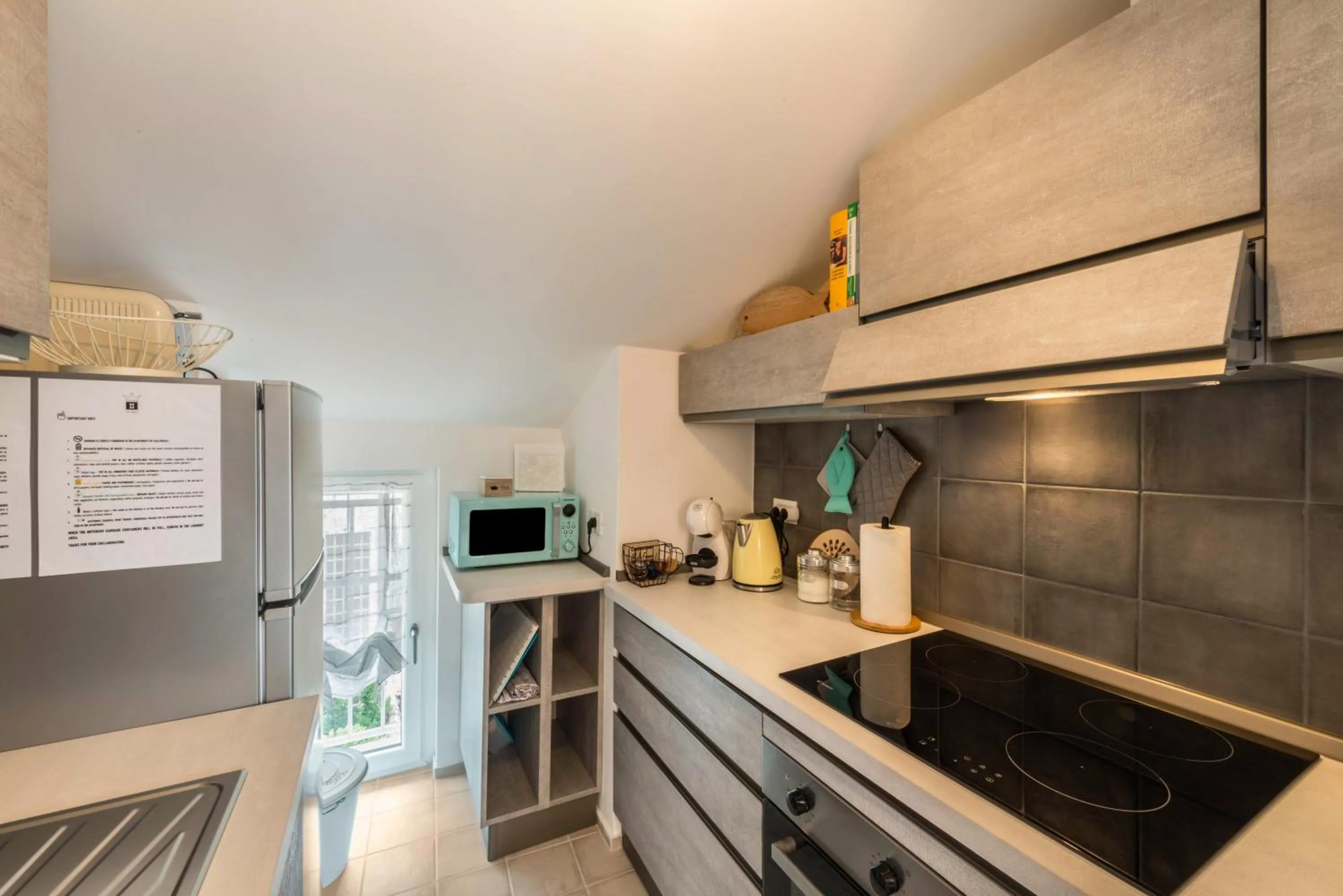 Kitchen or kitchenette in Casa Royale Appartamento Aria