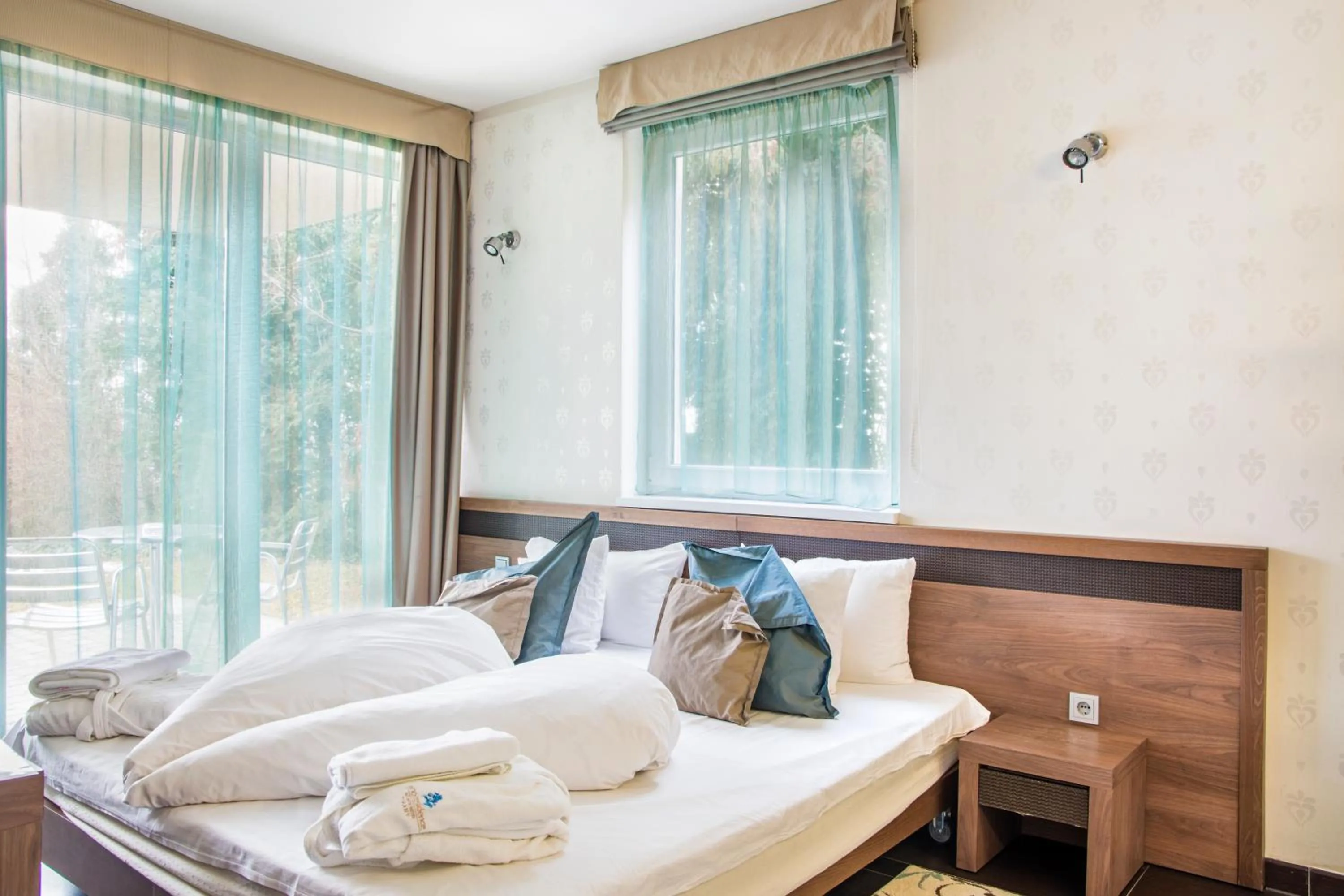 Bedroom in Echo Residence All Suite Hotel