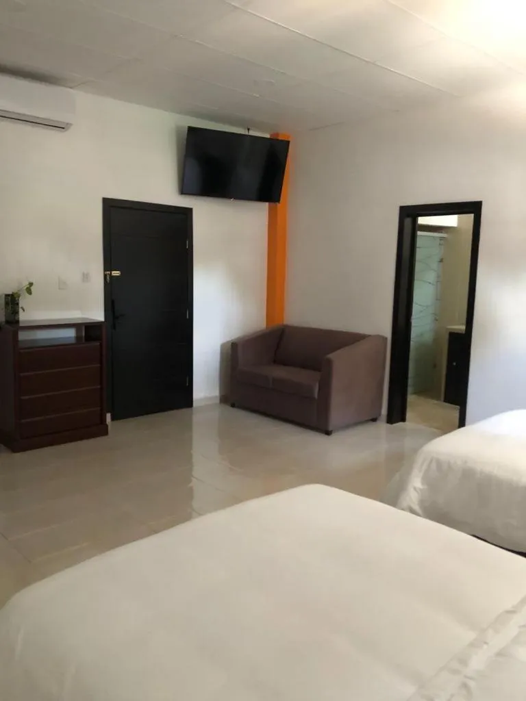 Seating area, Bed in Hotel boutique turquesa