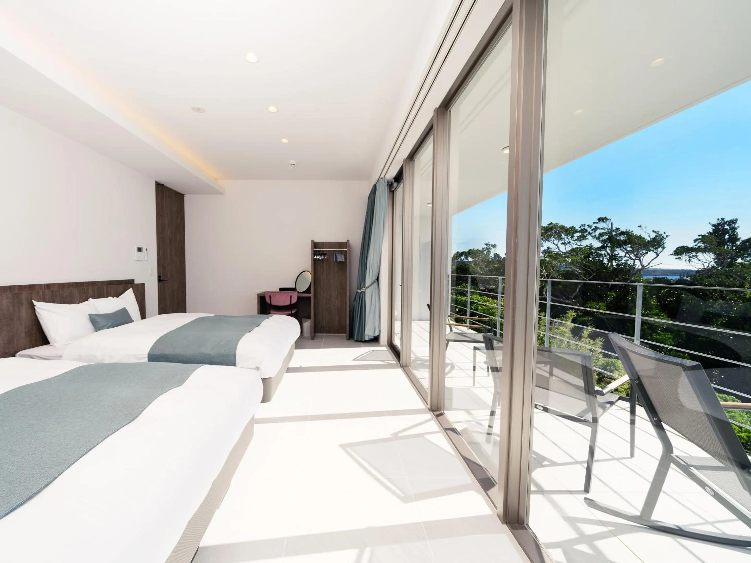 Balcony/Terrace, Bed in Blue Rela Luxe Resort Okinawa