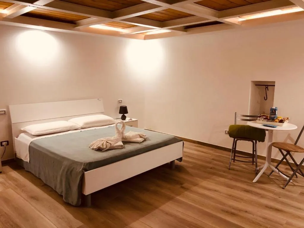 Bed in Mastropaolo42 Luxury B&B