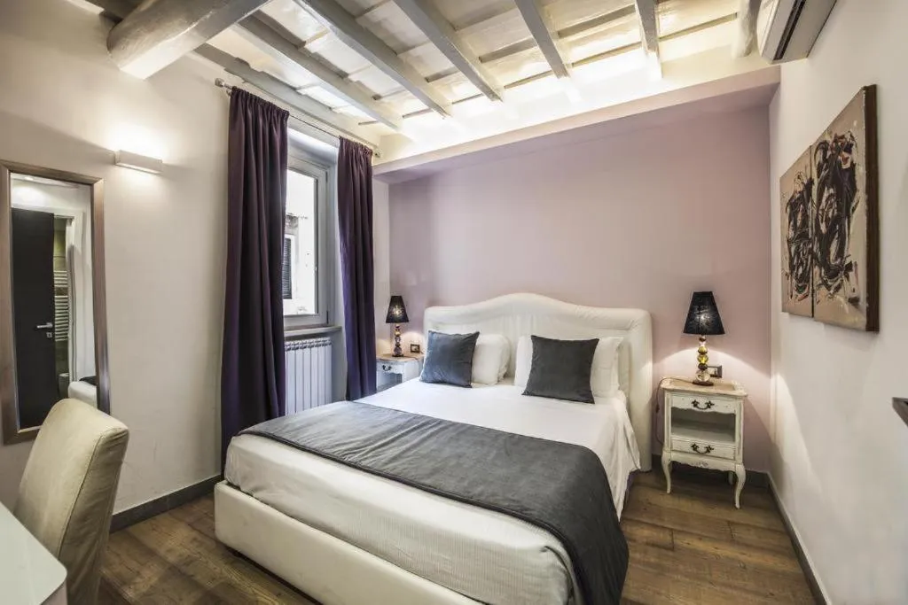 Bed in Corso Suite 107 Rooms Wellness & Spa