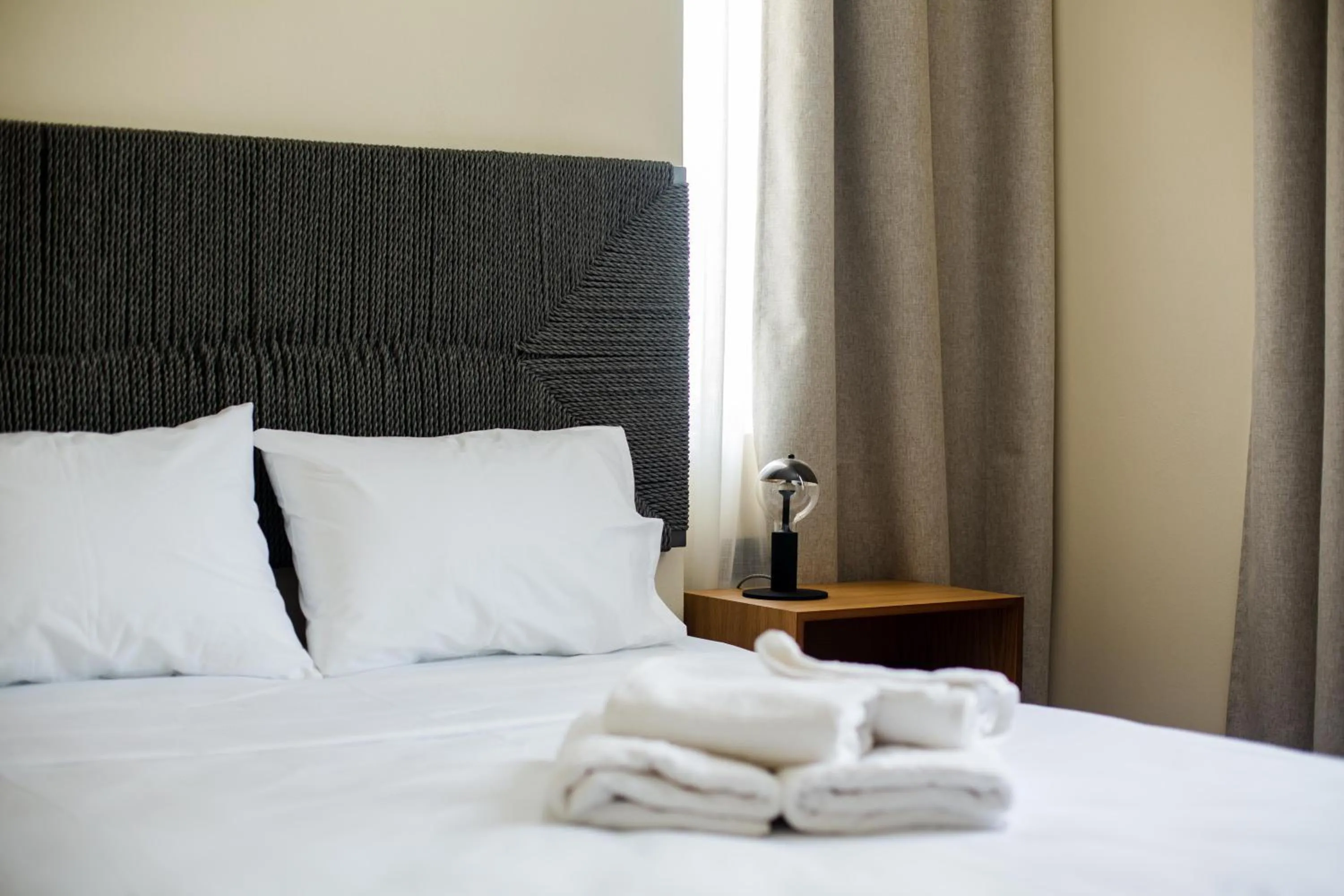 Bed in Leone Suites