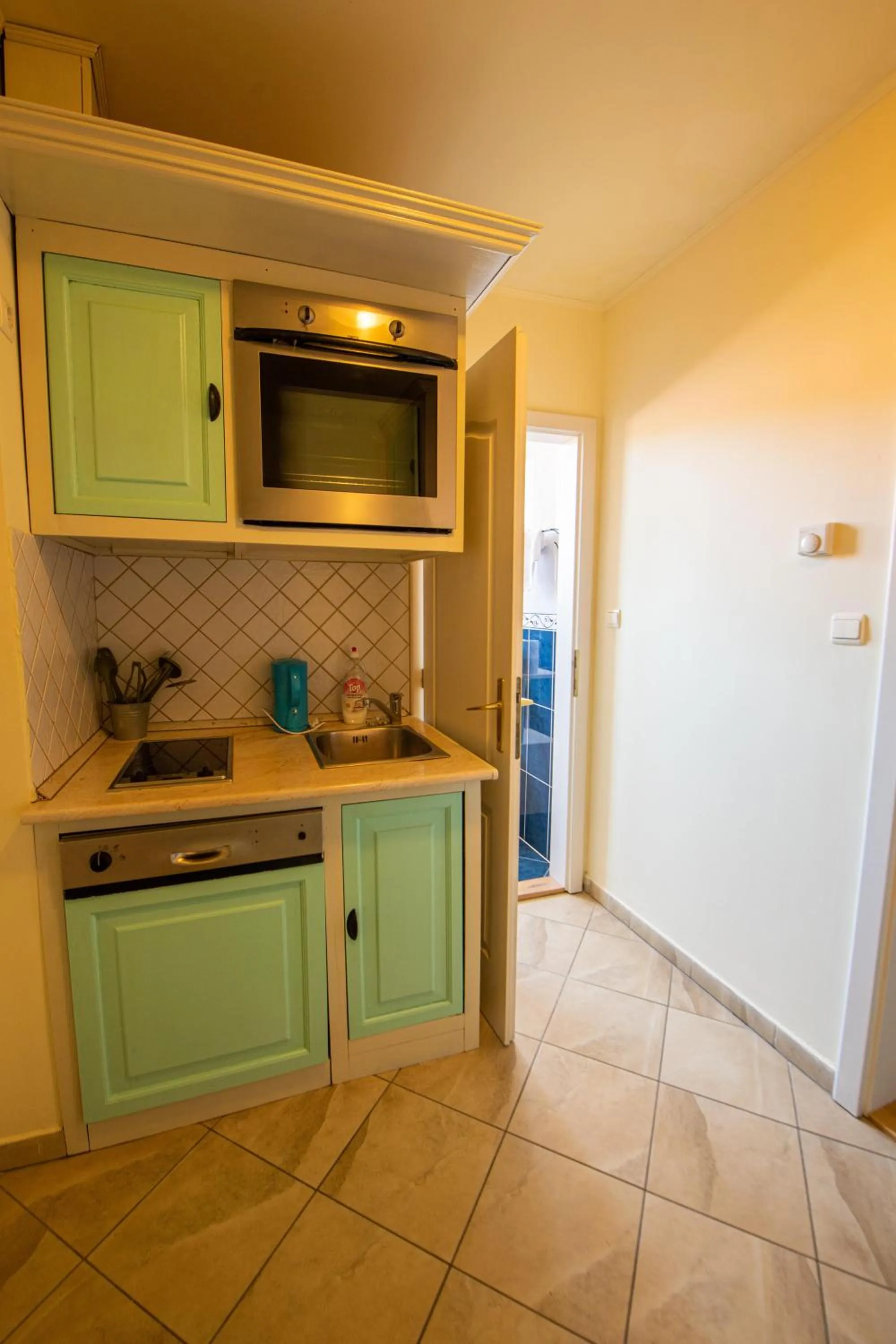 Kitchen or kitchenette in Pater Apartments and Rooms