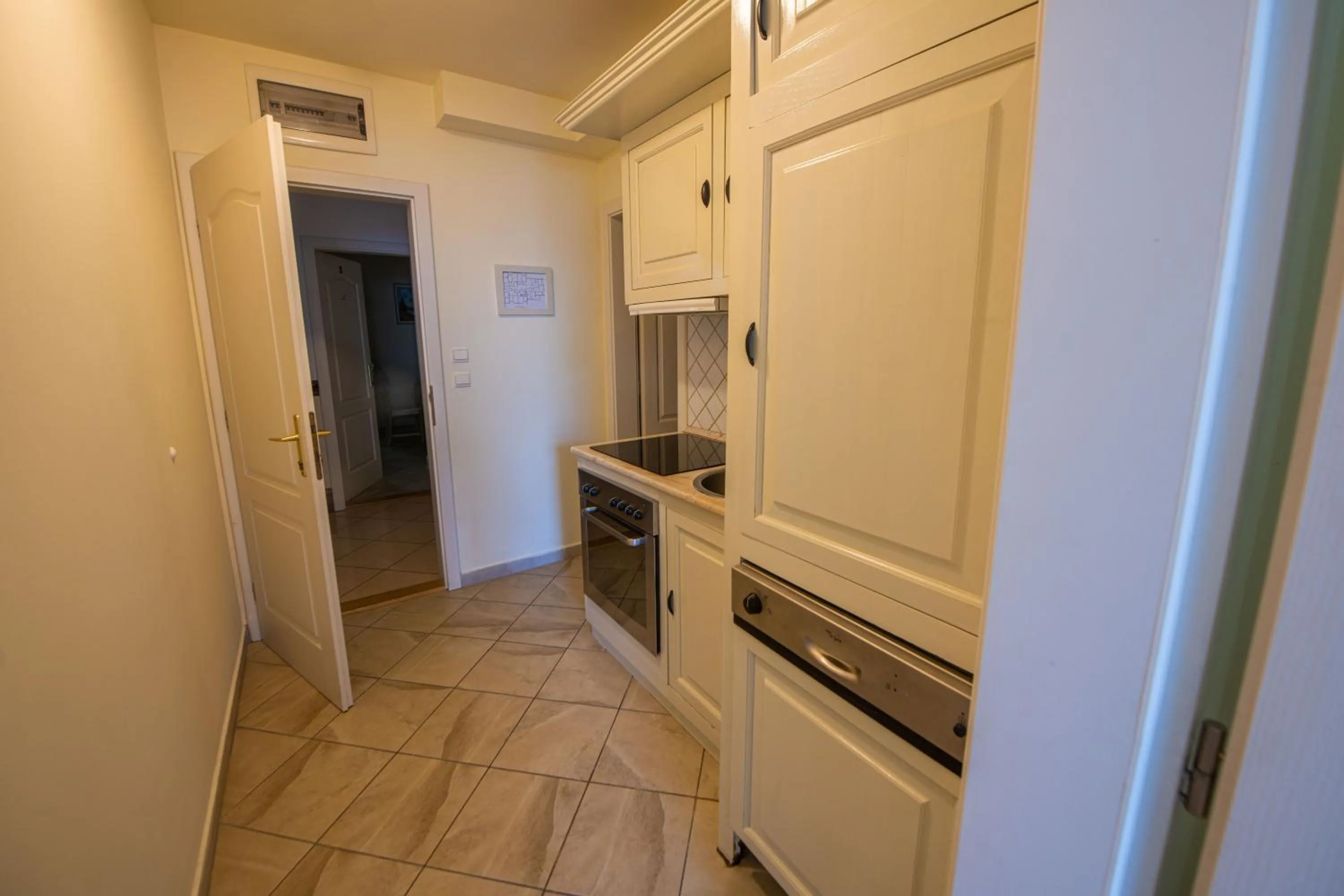Kitchen or kitchenette in Pater Apartments and Rooms