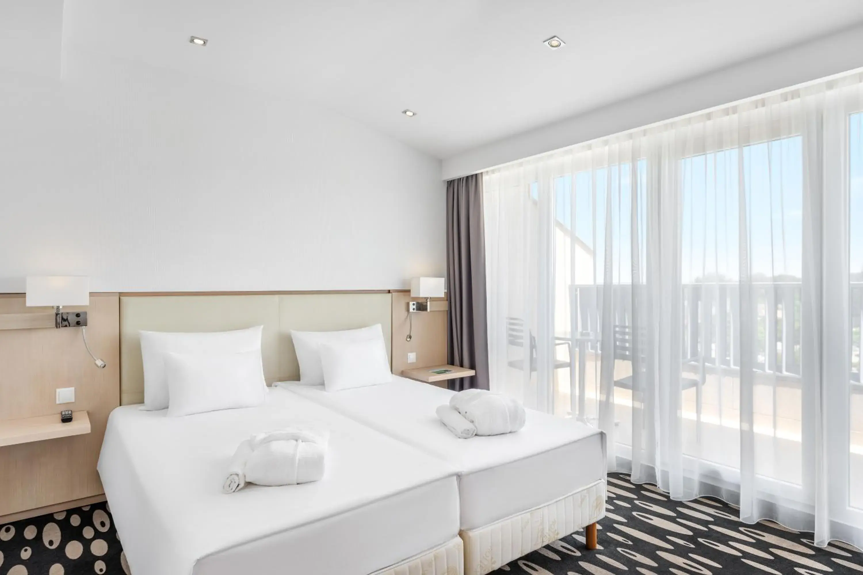 Bedroom, Bed in Park Inn by Radisson Sarvar Resort & Spa - All Inclusive Bedroom, Bed in Park Inn by Radisson Sarvar Resort & Spa - All Inclusive