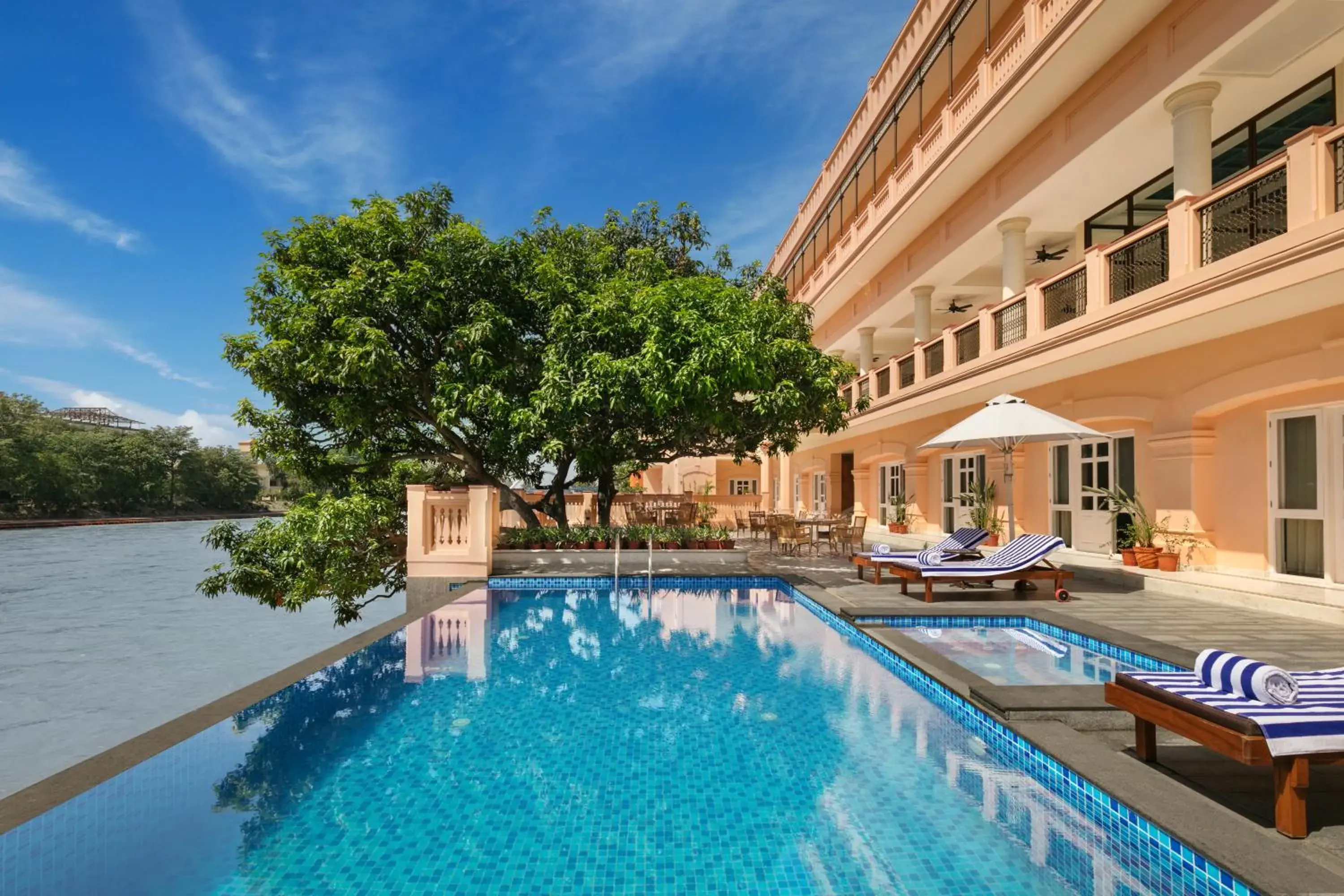 Swimming pool in Pilibhit House, Haridwar – IHCL SeleQtions Swimming pool in Pilibhit House, Haridwar – IHCL SeleQtions