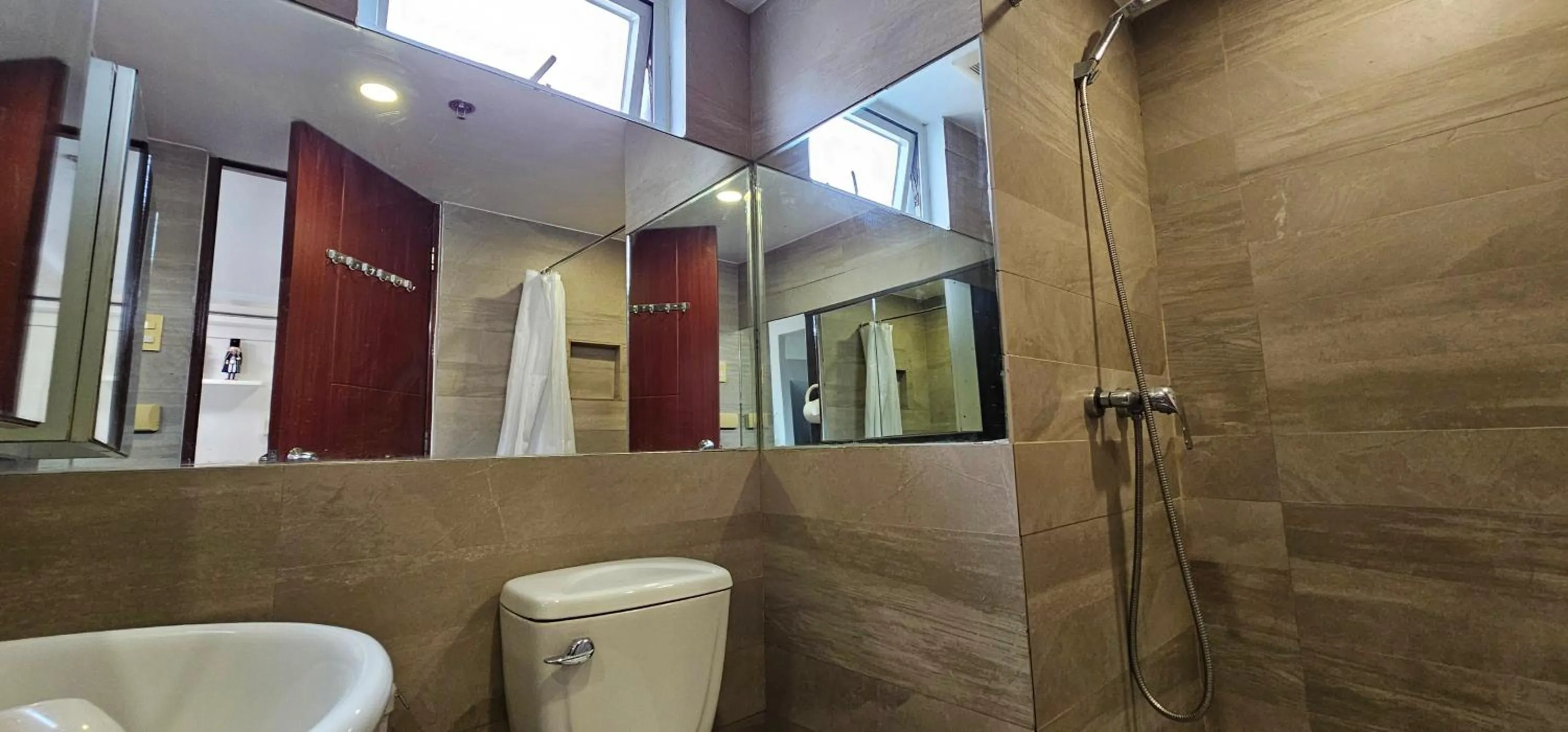 Shower in Gilmore Tower Suites By SMS Hospitality