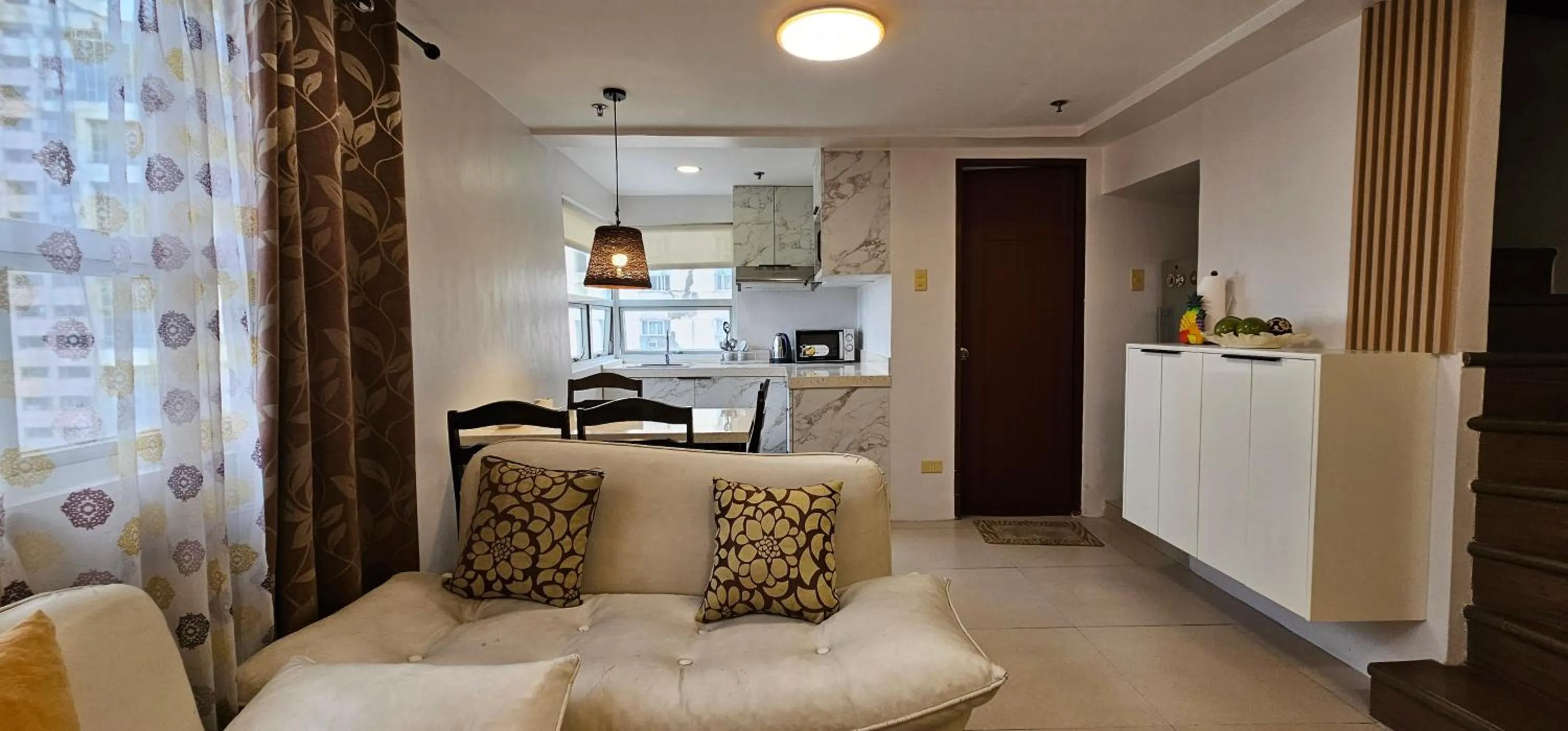 Living room in Gilmore Tower Suites By SMS Hospitality