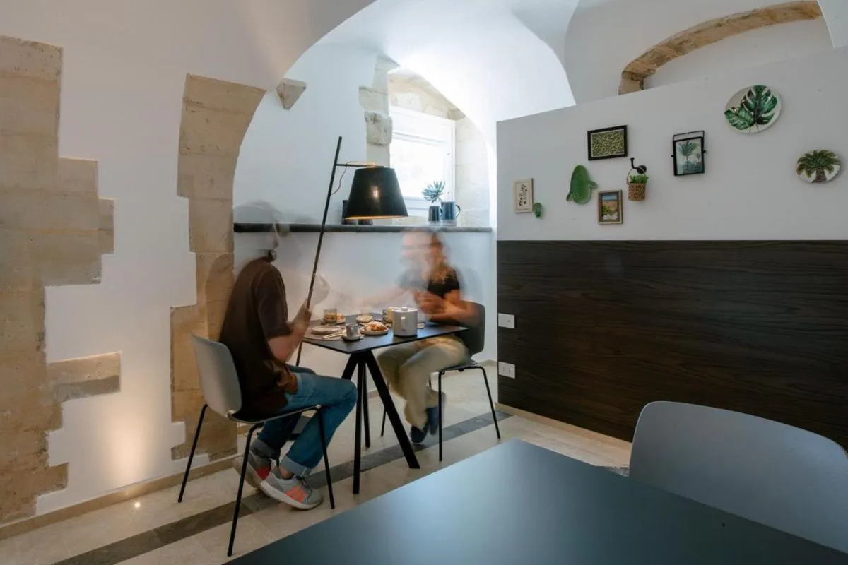 Communal lounge/ TV room in IBLA ROOMS