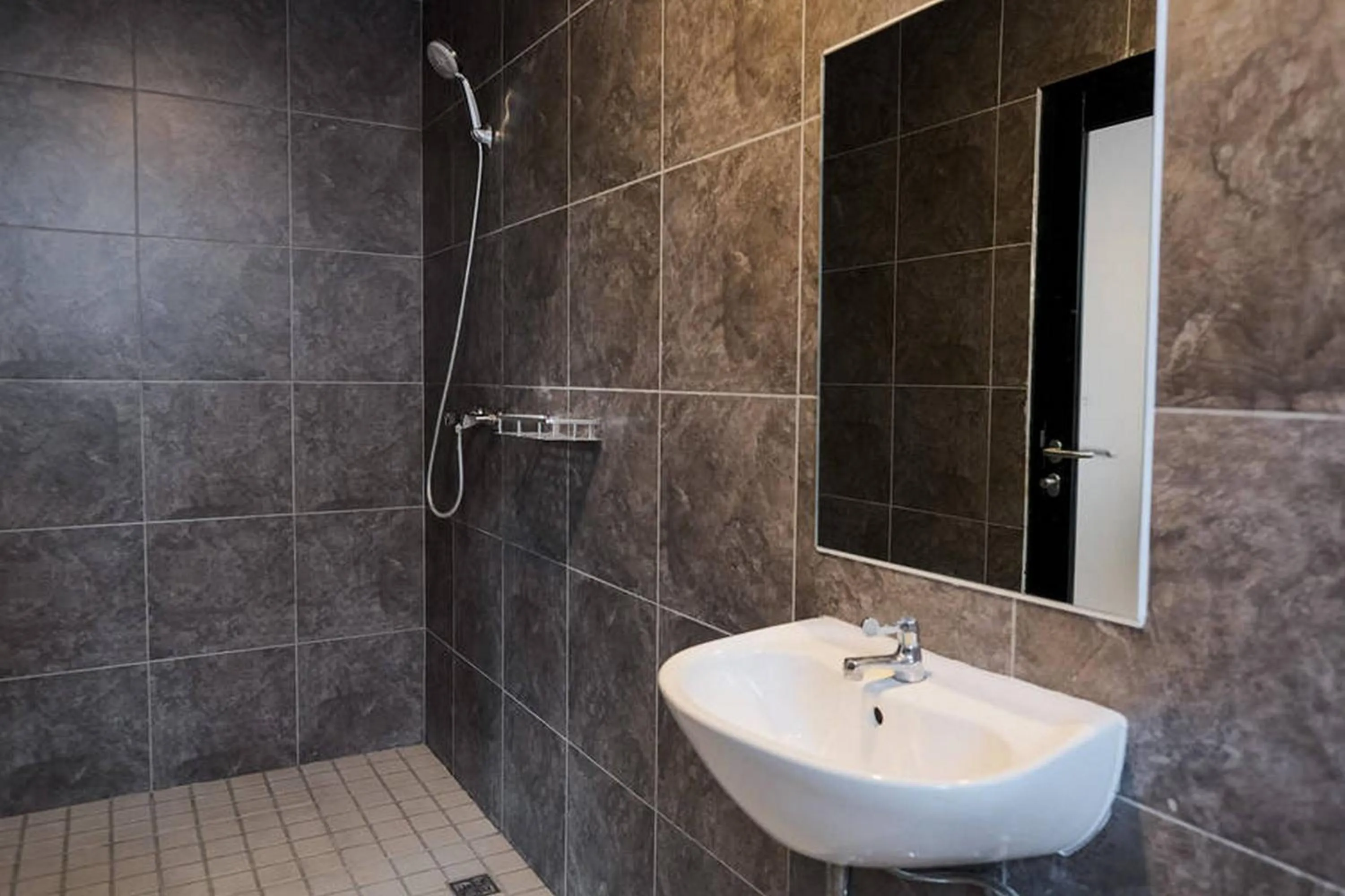 Bathroom in RedDoorz Plus near Taman Anggrek Mall