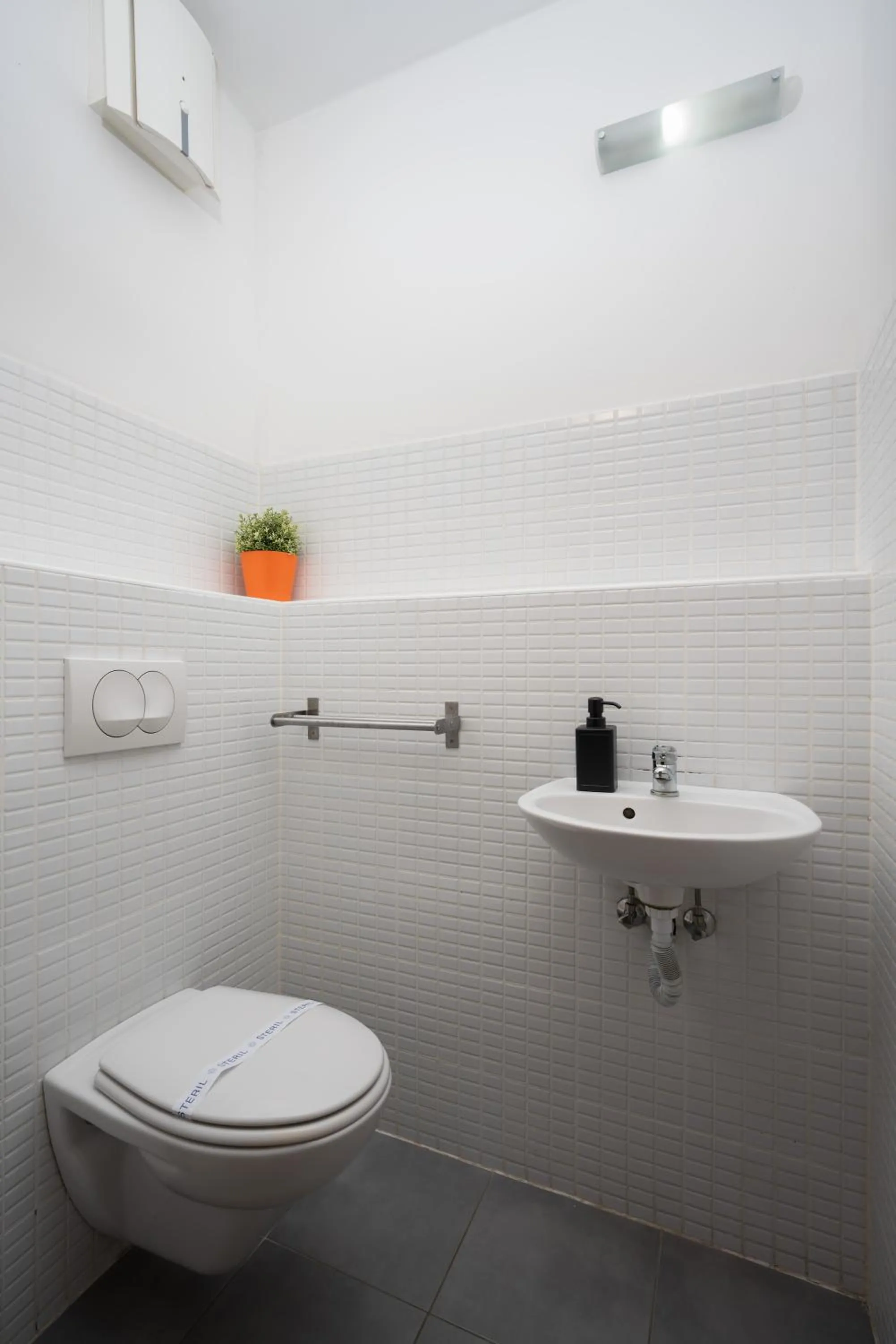 Toilet in Central Passage Apartments by Vagabond Downtown