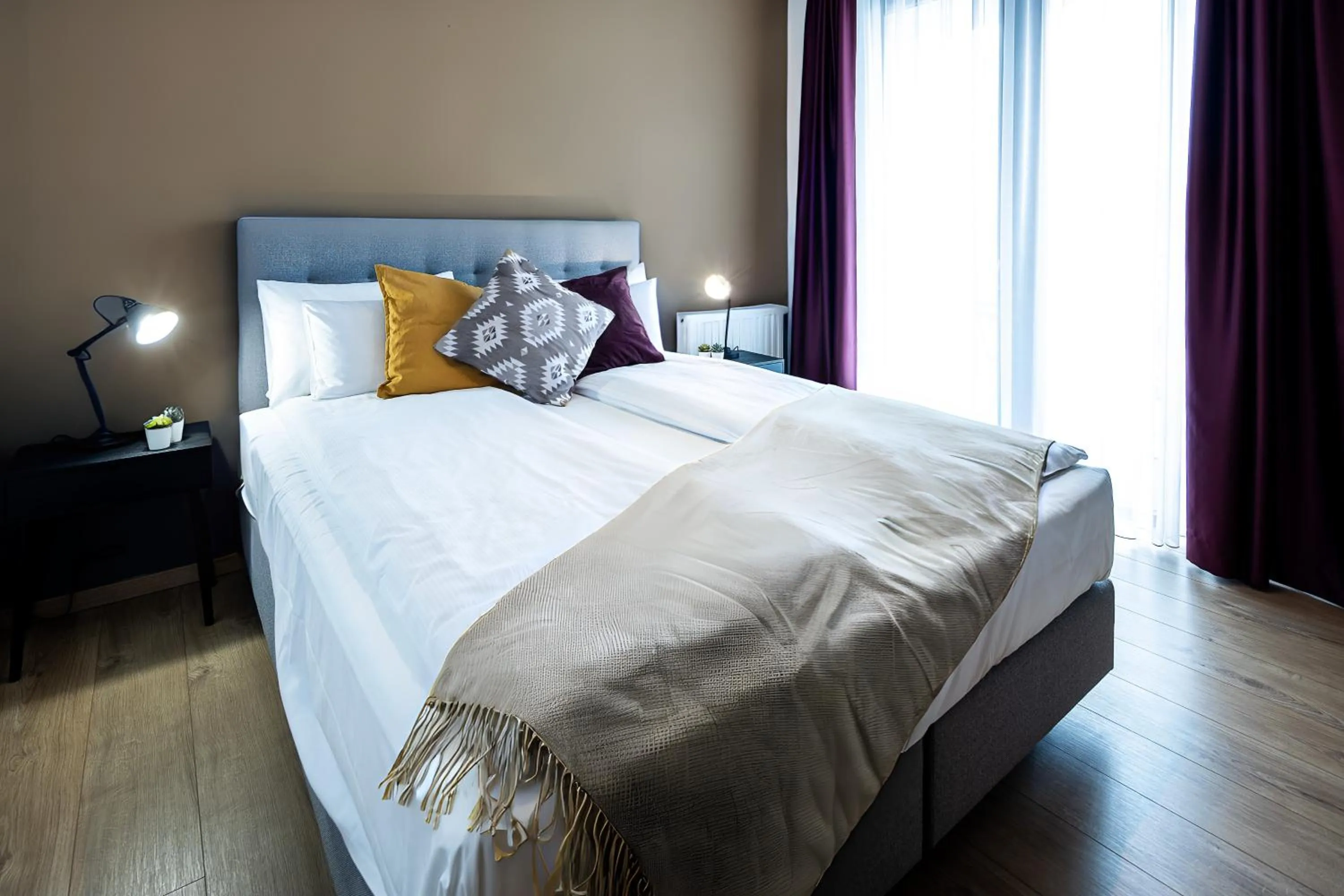 Bedroom, Bed in Central Passage Apartments by Vagabond Downtown