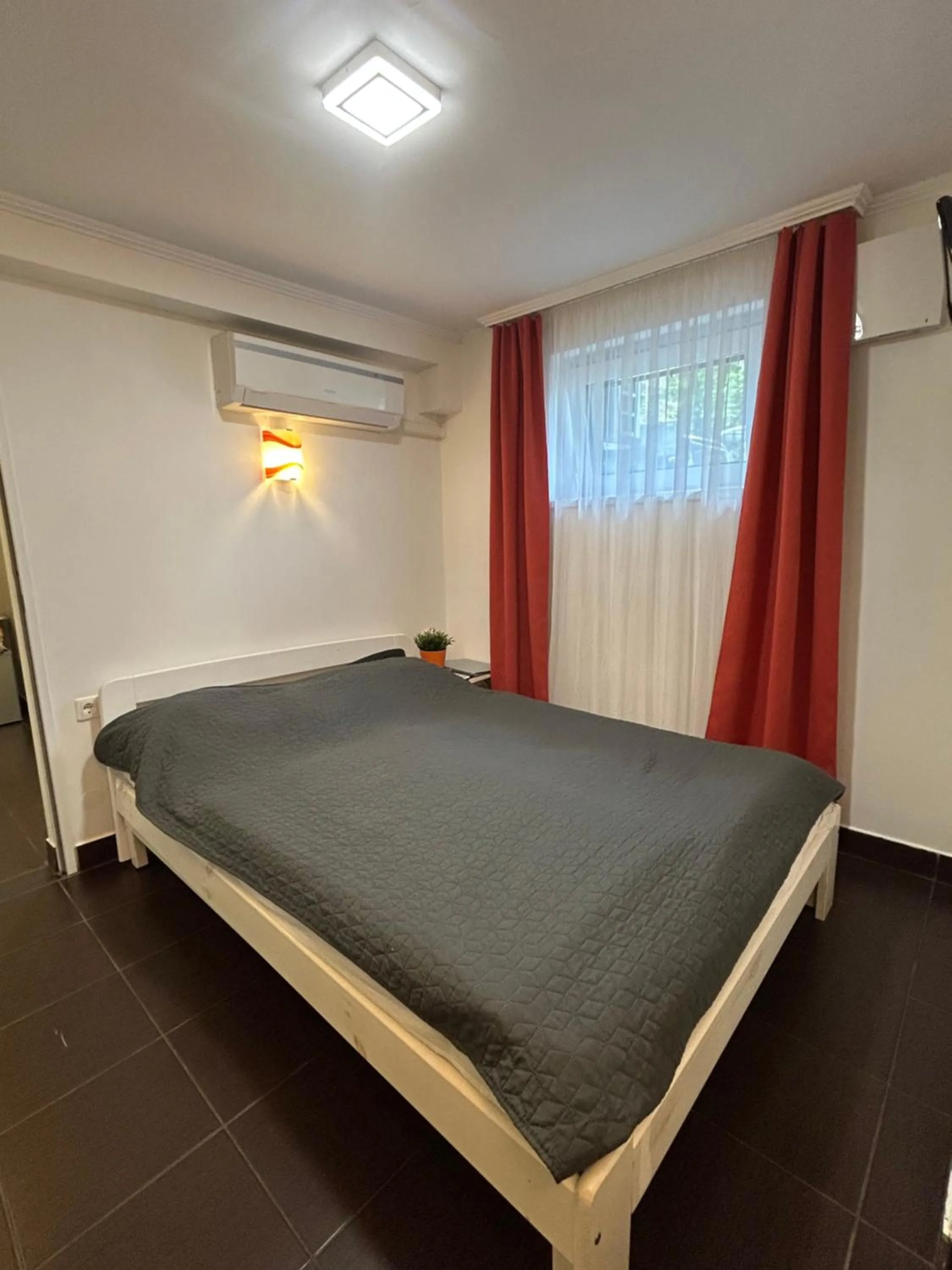 Bed in Caesar Apartments & Rooms