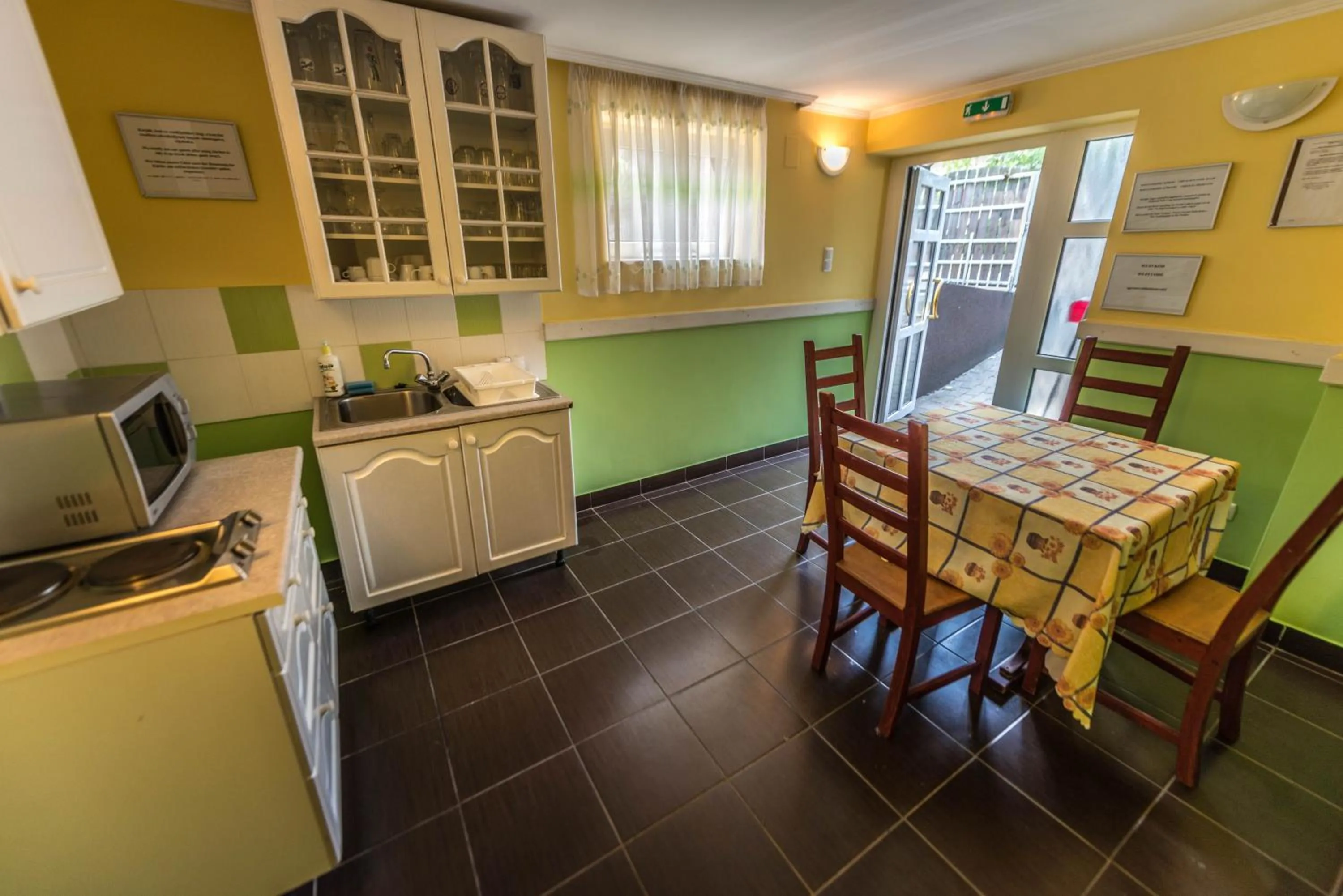 Kitchen or kitchenette in Caesar Apartments & Rooms