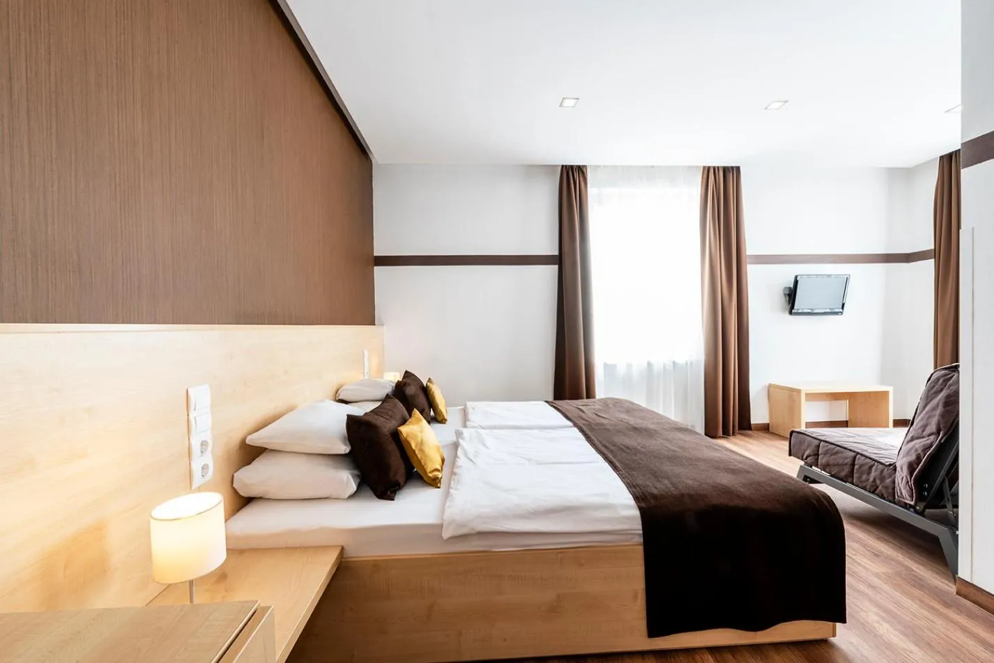 Bed in Promenade City Hotel