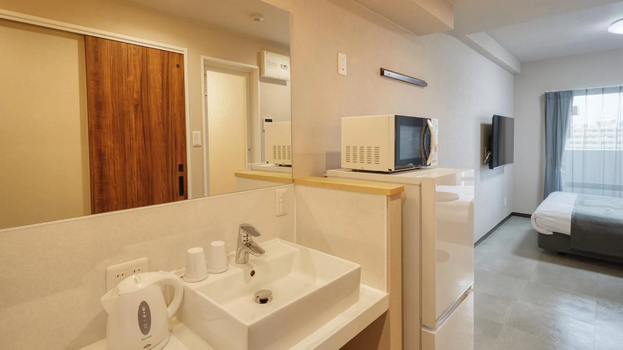 Photo of the whole room, Bed in New Normal Hotel in MATSUYAMA ニューノーマルホテルイン松山