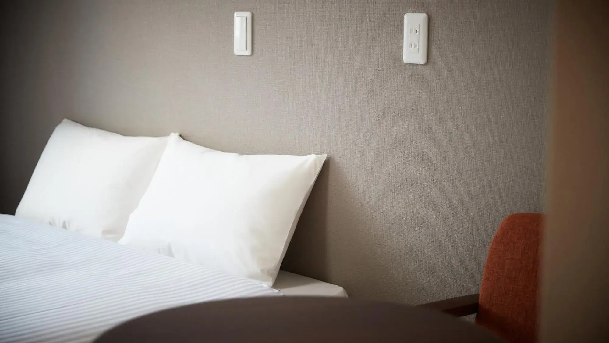 Bed in New Normal Hotel in MATSUYAMA ニューノーマルホテルイン松山 Bed in New Normal Hotel in MATSUYAMA ニューノーマルホテルイン松山