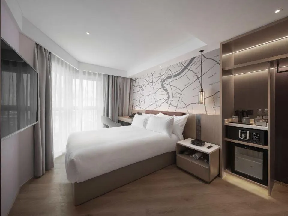 Bed in Holiday Inn Shanghai Huaxia by IHG - overlooking city scenery at Sky View Restaurant