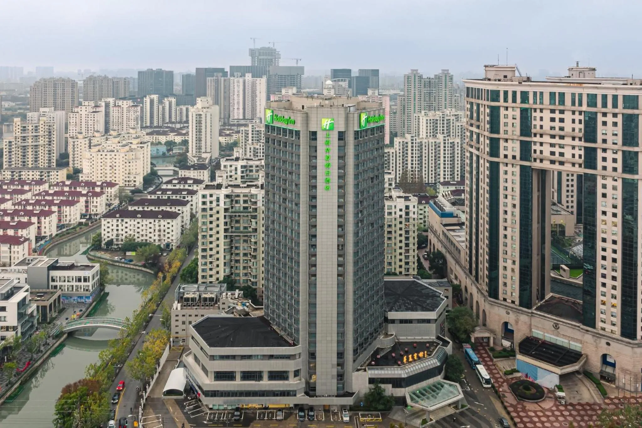 Property building in Holiday Inn Shanghai Huaxia by IHG - overlooking city scenery at Sky View Restaurant