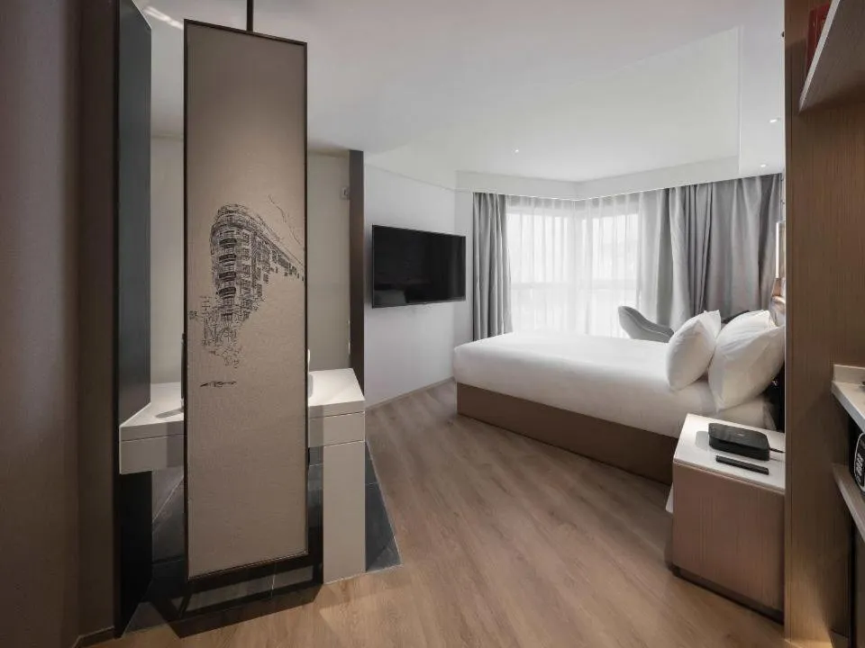 Bed in Holiday Inn Shanghai Huaxia by IHG - overlooking city scenery at Sky View Restaurant