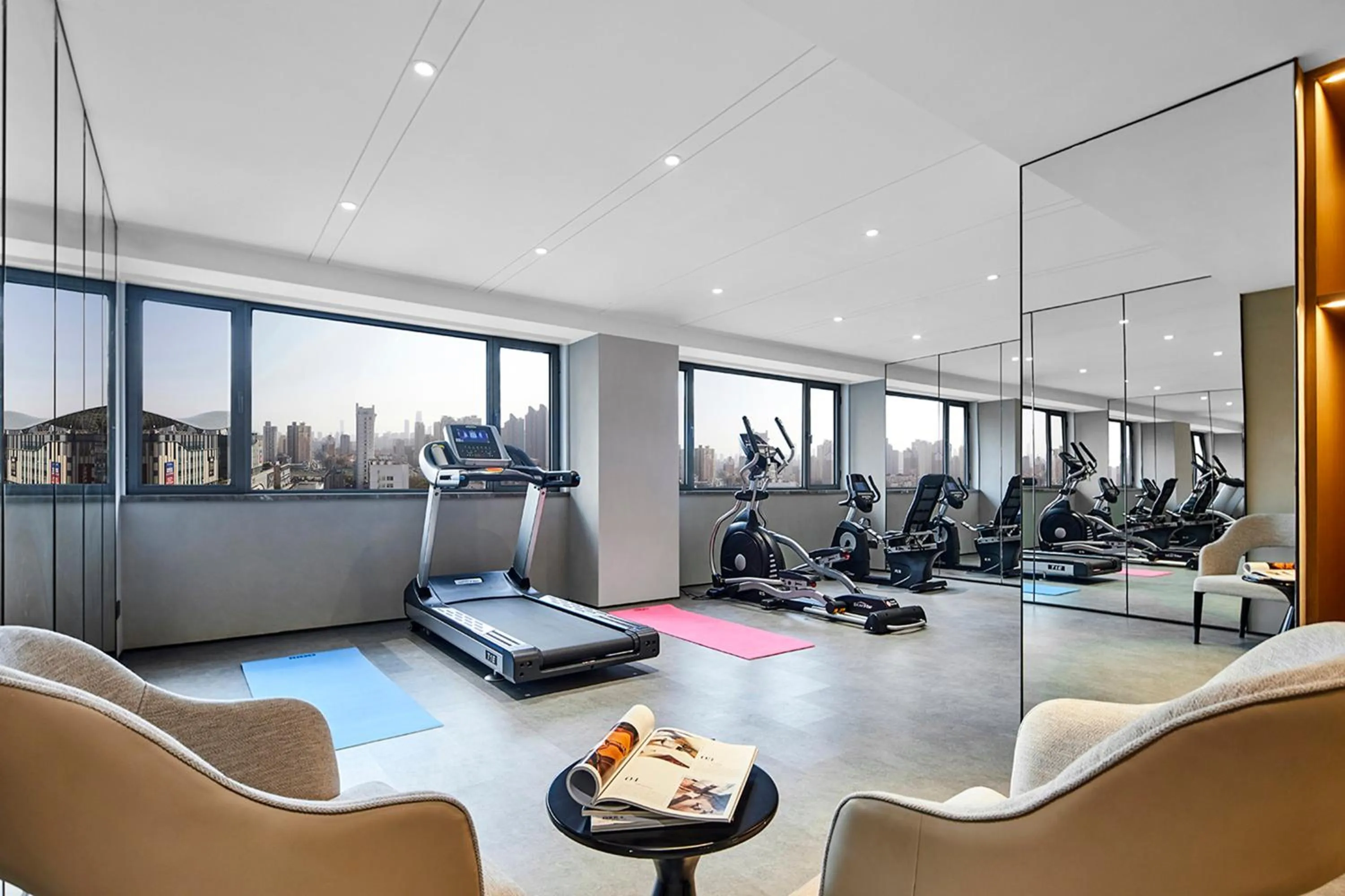 Fitness centre/facilities in Holiday Inn Shanghai Huaxia by IHG - overlooking city scenery at Sky View Restaurant