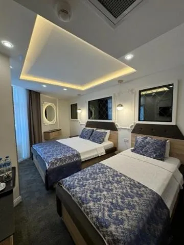 Bed in AYDINLI HOTEL