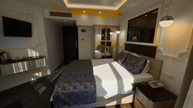 Bed in AYDINLI HOTEL