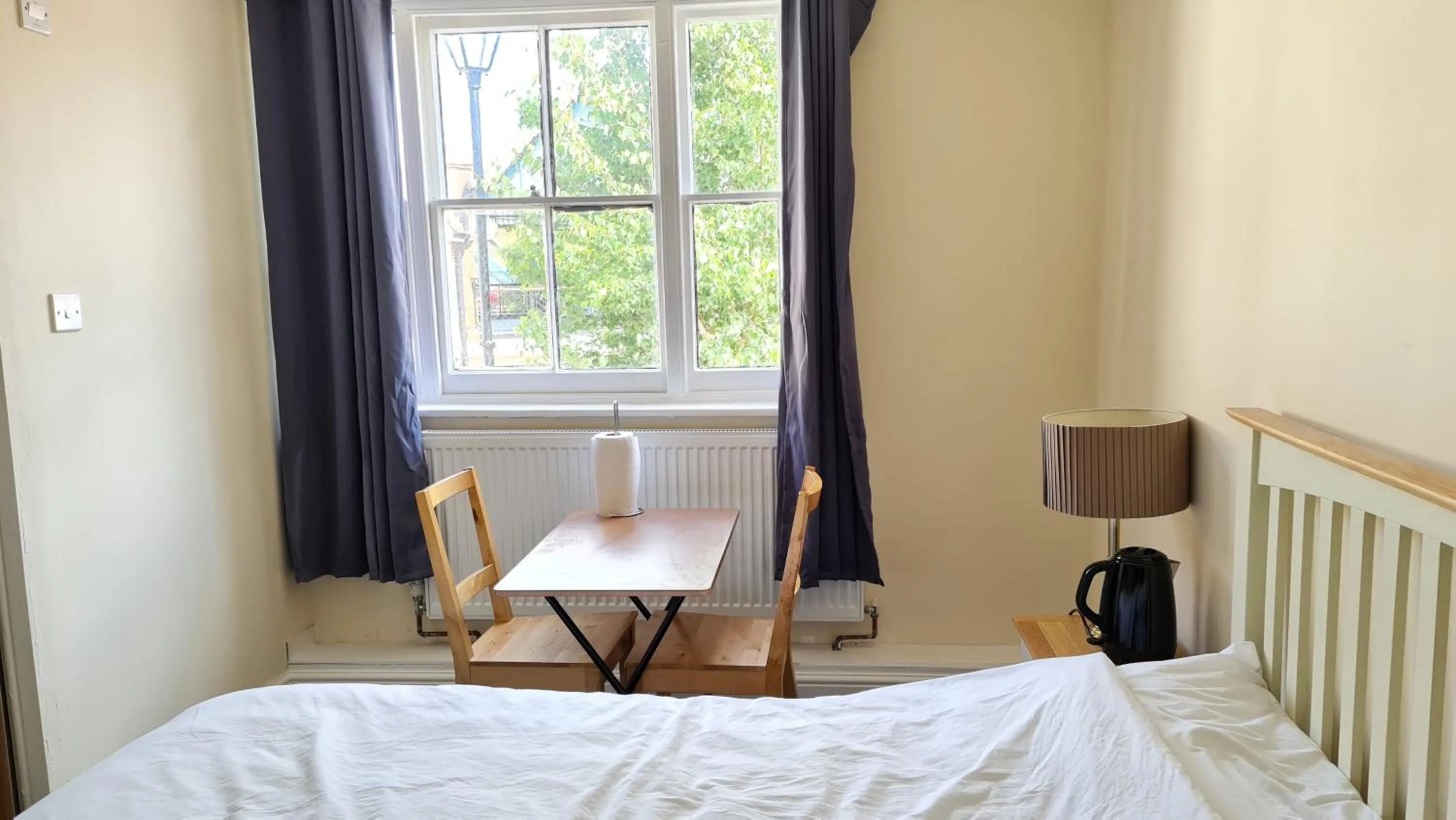 Bedroom, Bed in Grace Apartments - Living Rock