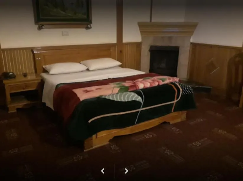 Bed in Greens Hotel Kalam