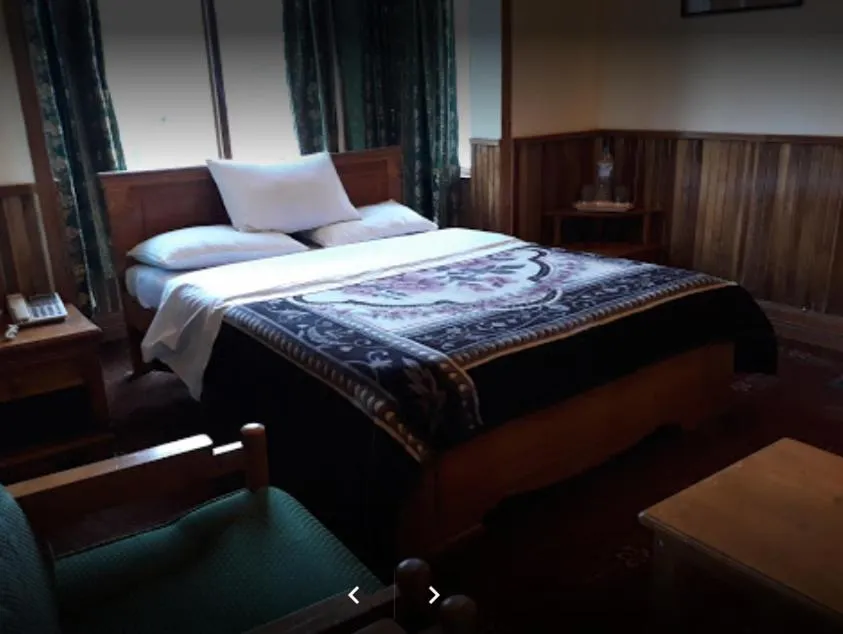 Bed in Greens Hotel Kalam