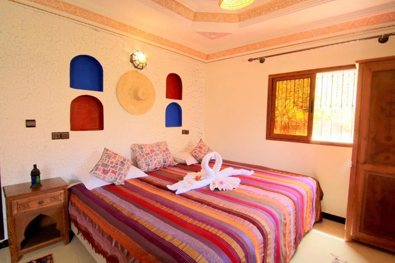 Photo of the whole room, Bed in Jnane Karma