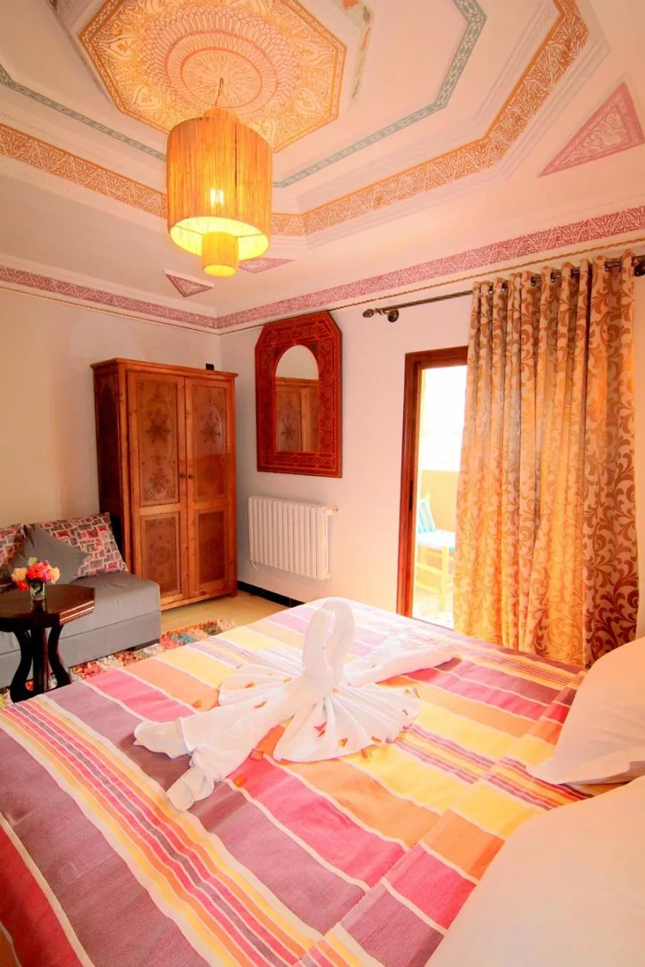 Photo of the whole room, Bed in Jnane Karma