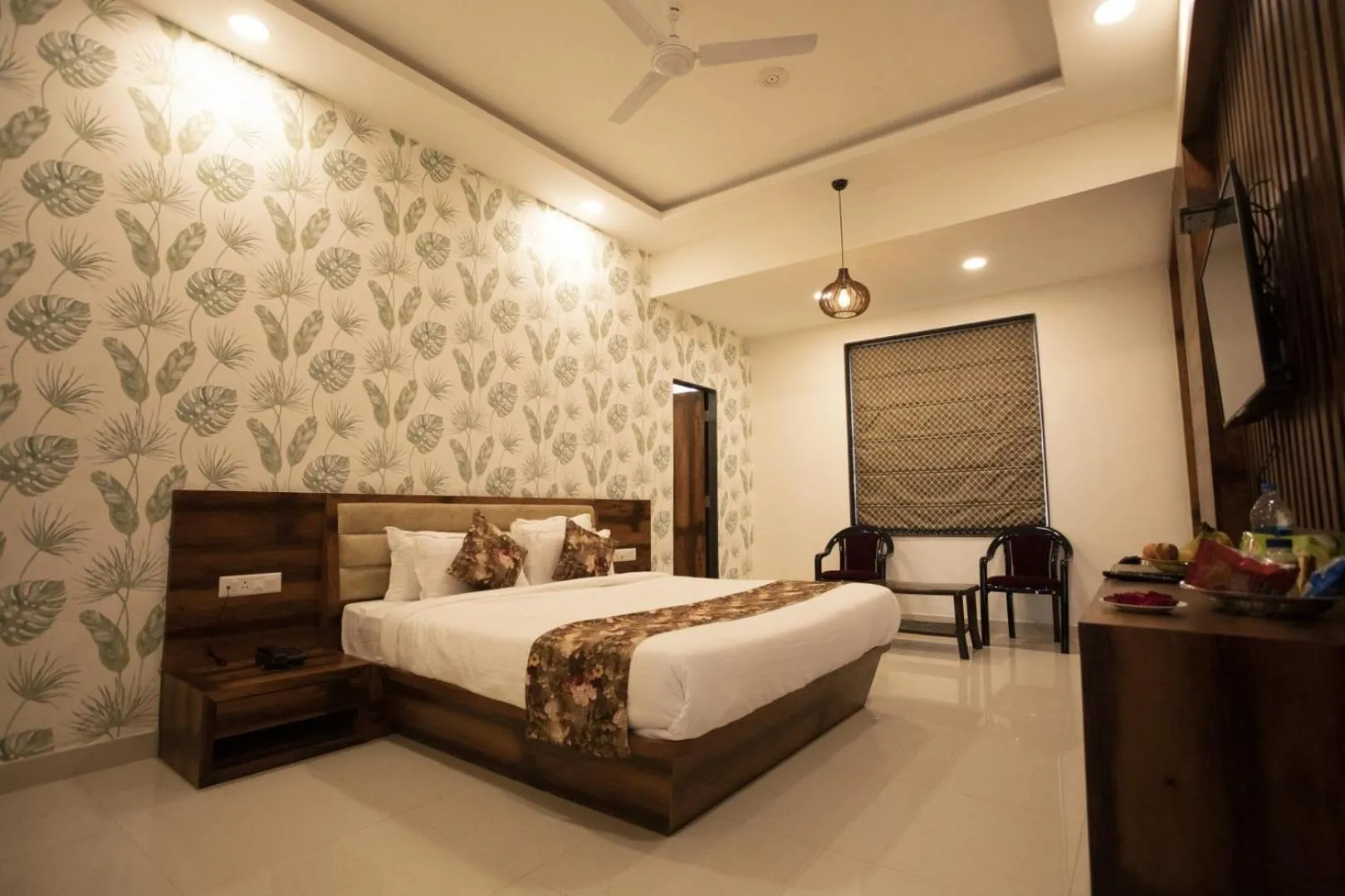 Photo of the whole room, Bed in Hotel Bhairav Bagh with Swimming Pool