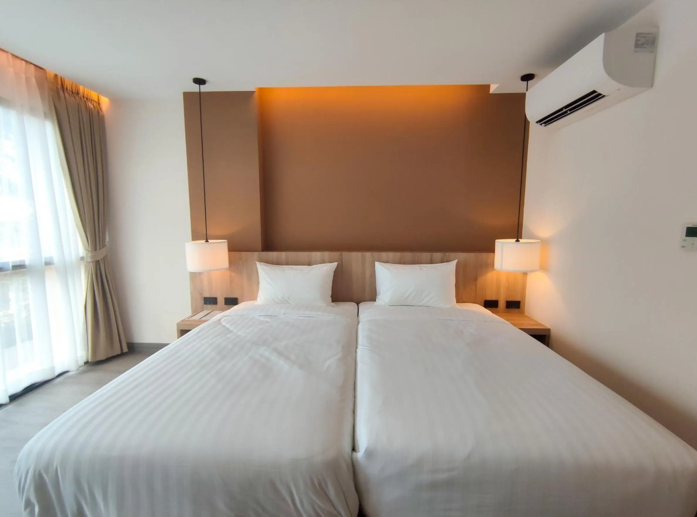 Bed in Hi Chiangmai Hotel