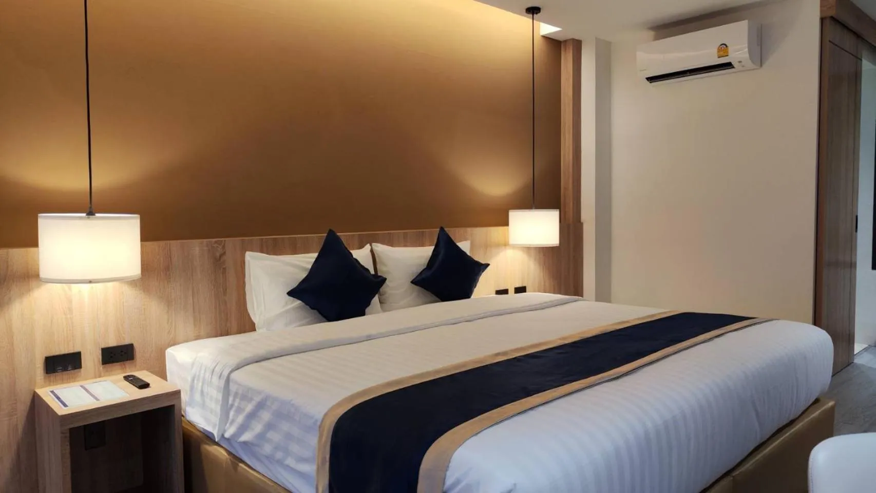 Bed in Hi Chiangmai Hotel