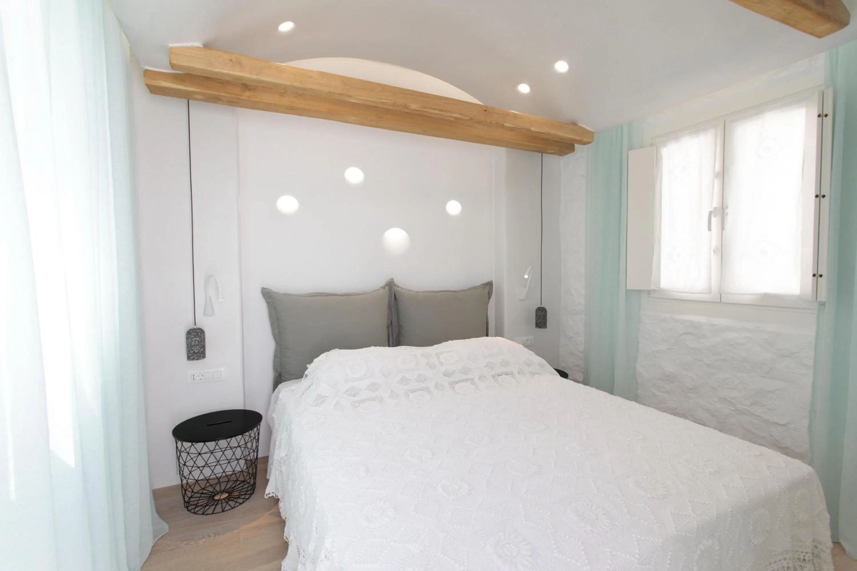 Bed in Majo Suites Hotel