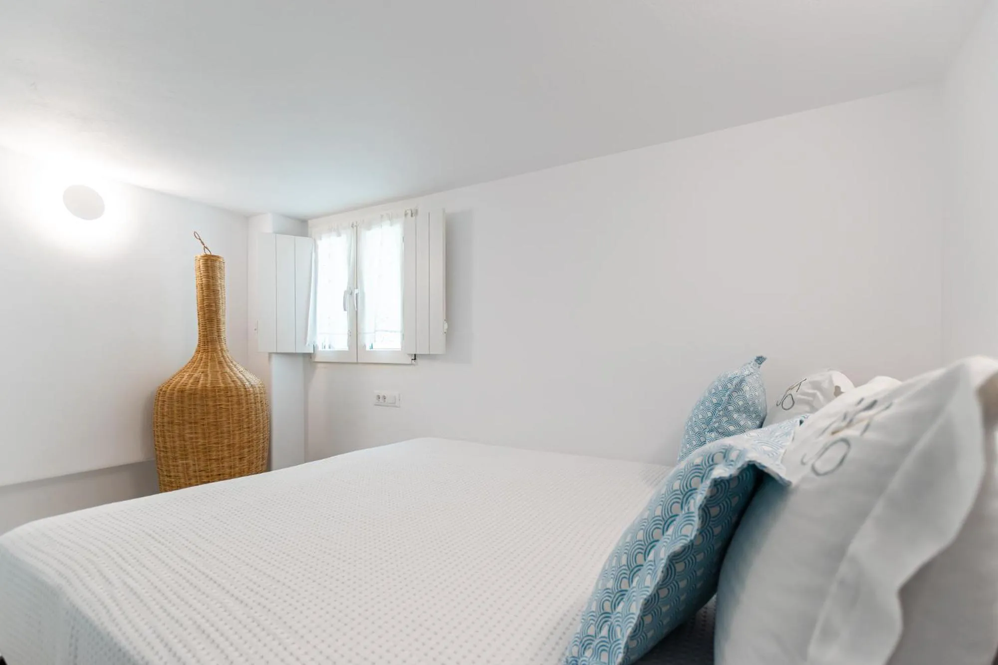 Bed in Majo Suites Hotel