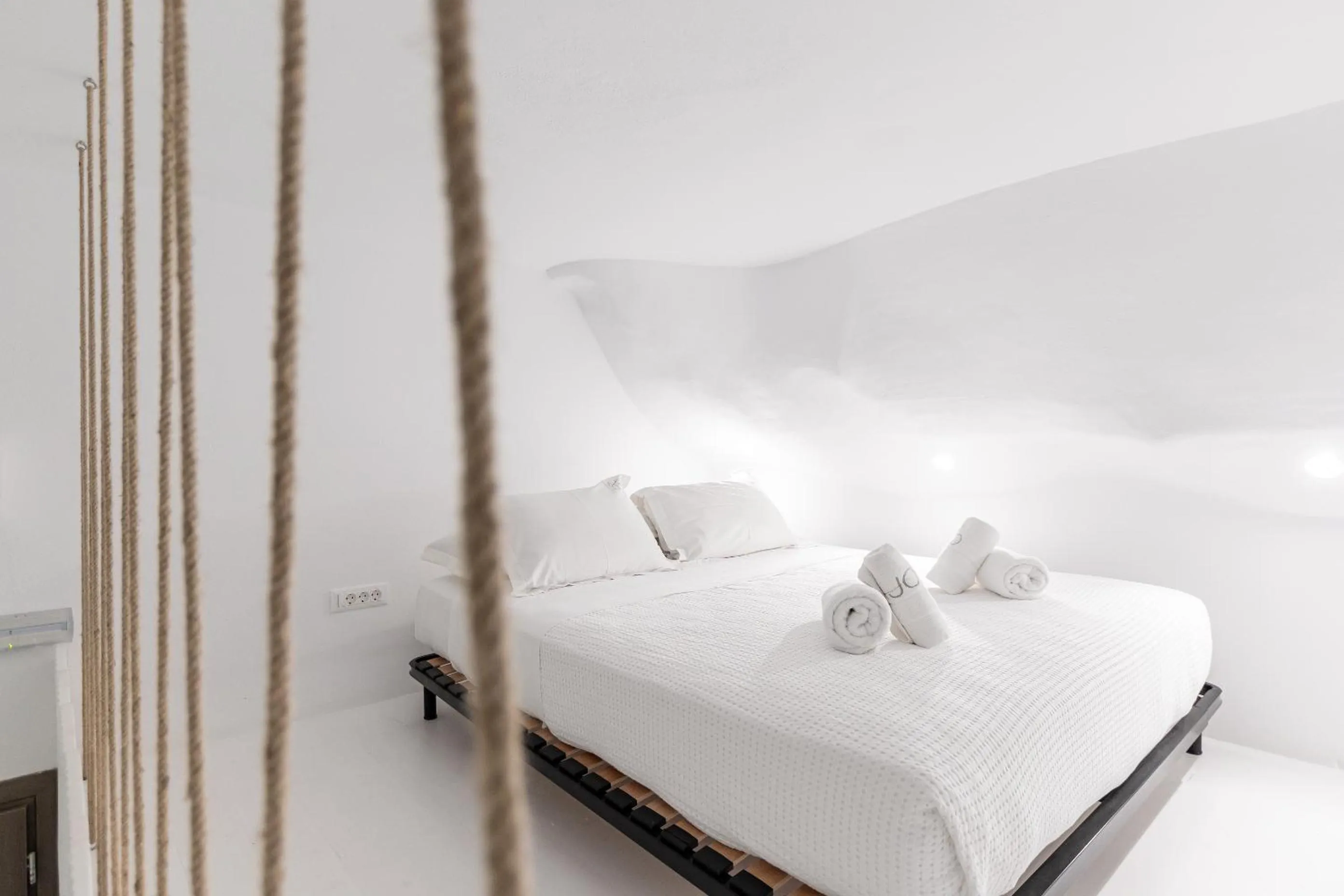 Bed in Majo Suites Hotel