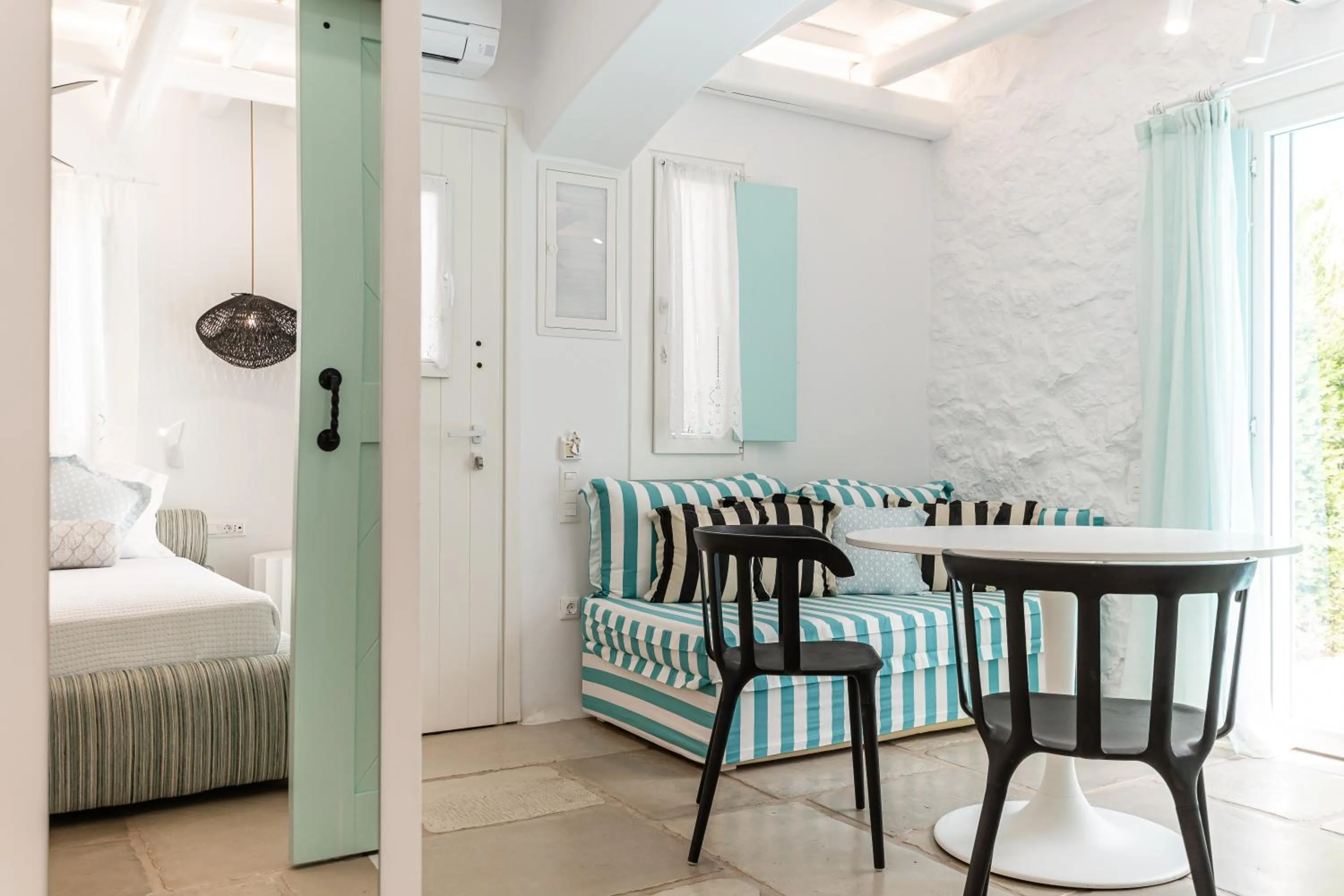 Patio, Bed in Majo Suites Hotel