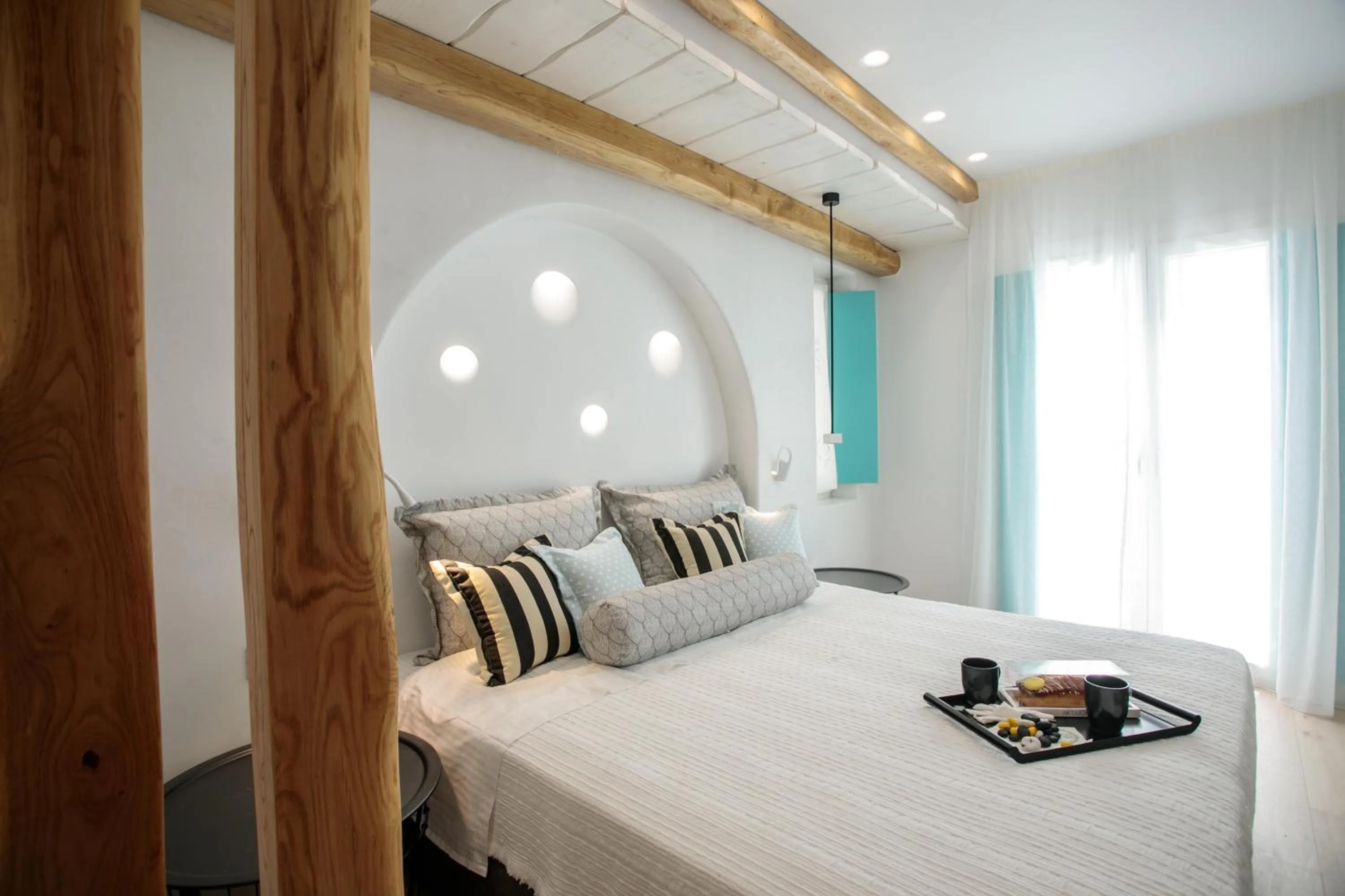 Bed in Majo Suites Hotel