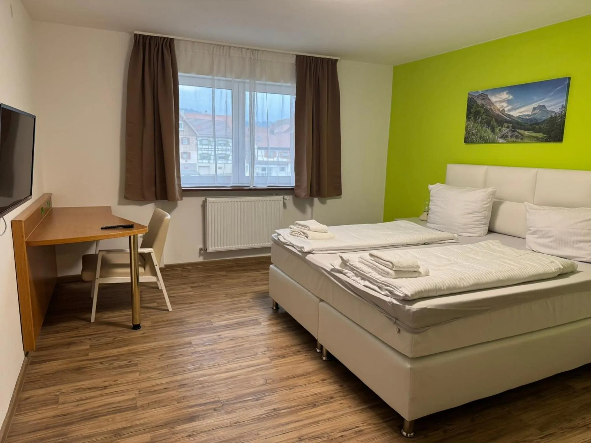 Bed in Hotel Grüner Baum - Melissone Italian Restaurant