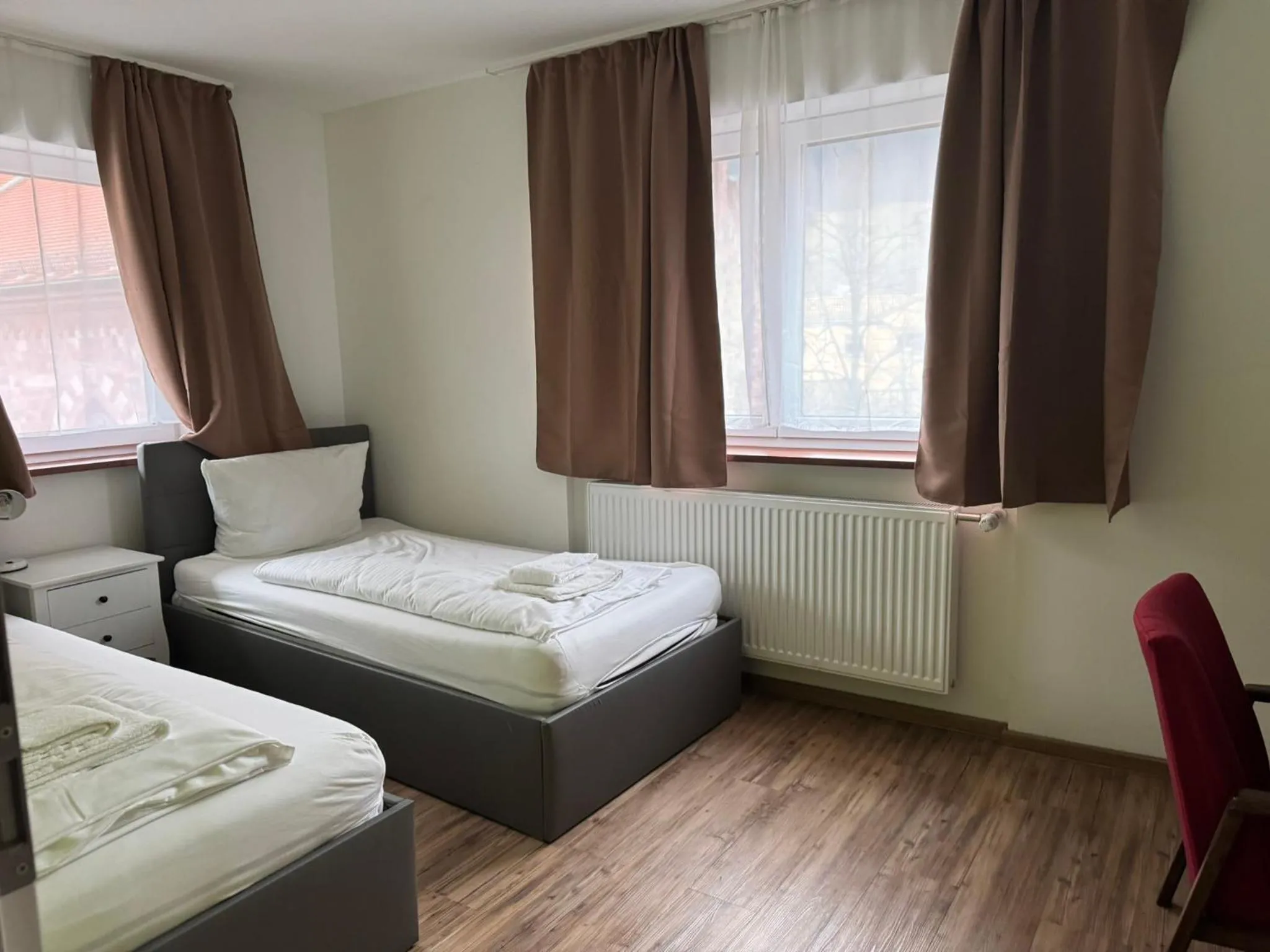 Bed in Hotel Grüner Baum - Melissone Italian Restaurant