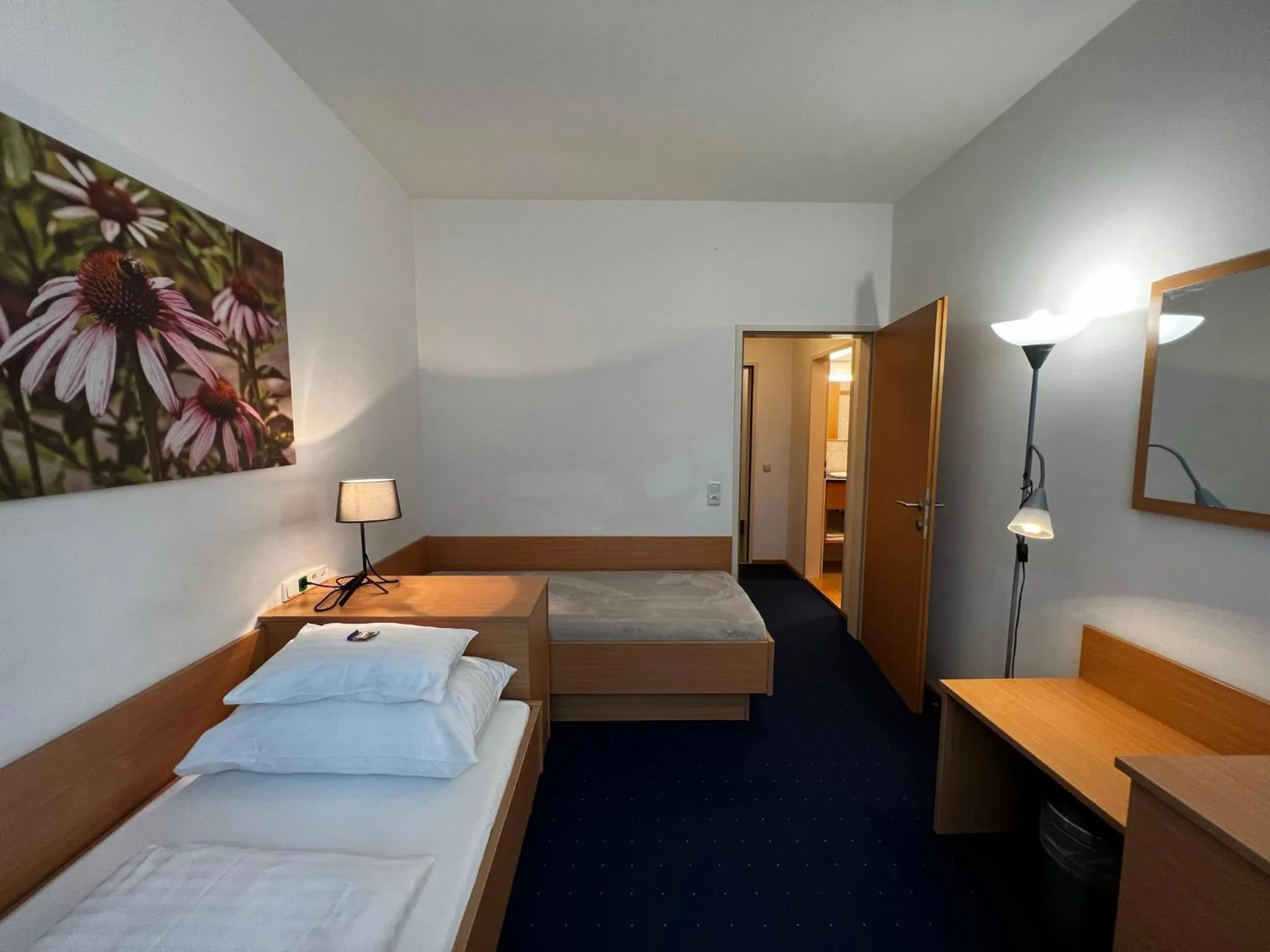 Photo of the whole room, Bed in H+ Hotel Ried