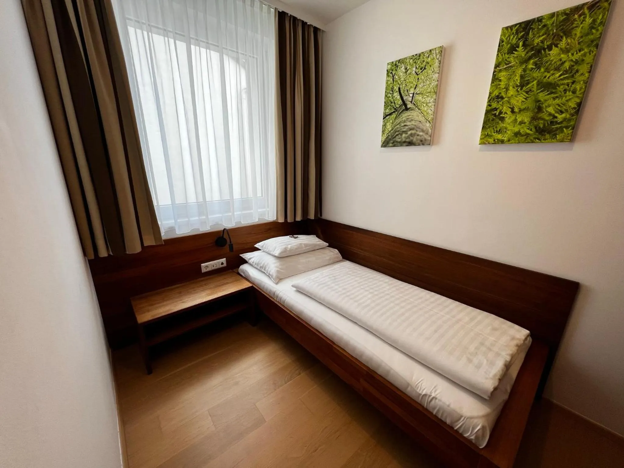 Photo of the whole room, Bed in H+ Hotel Ried