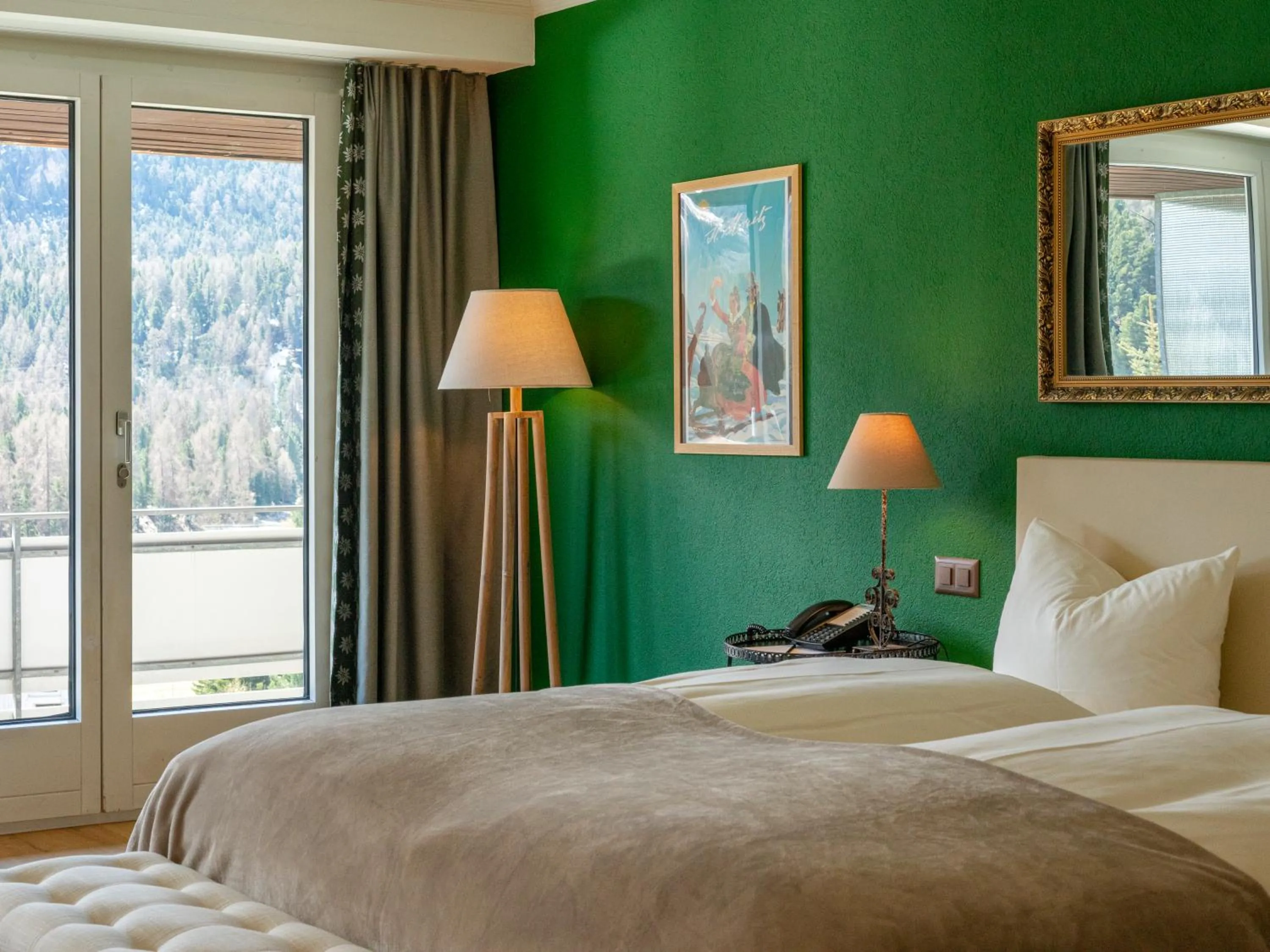 Bed in Hotel Europa Suites St Moritz
