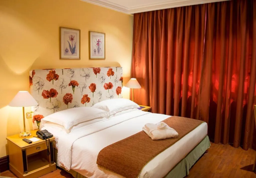 Bedroom in Le Royal Hotel